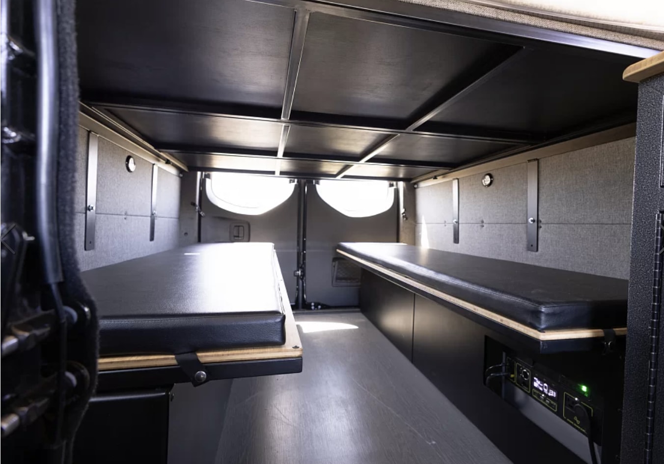 RV rental: Functional camper van interior featuring two platform beds, under-bed storage, and a power station.. Vanworks Switchback 4D 144 2022