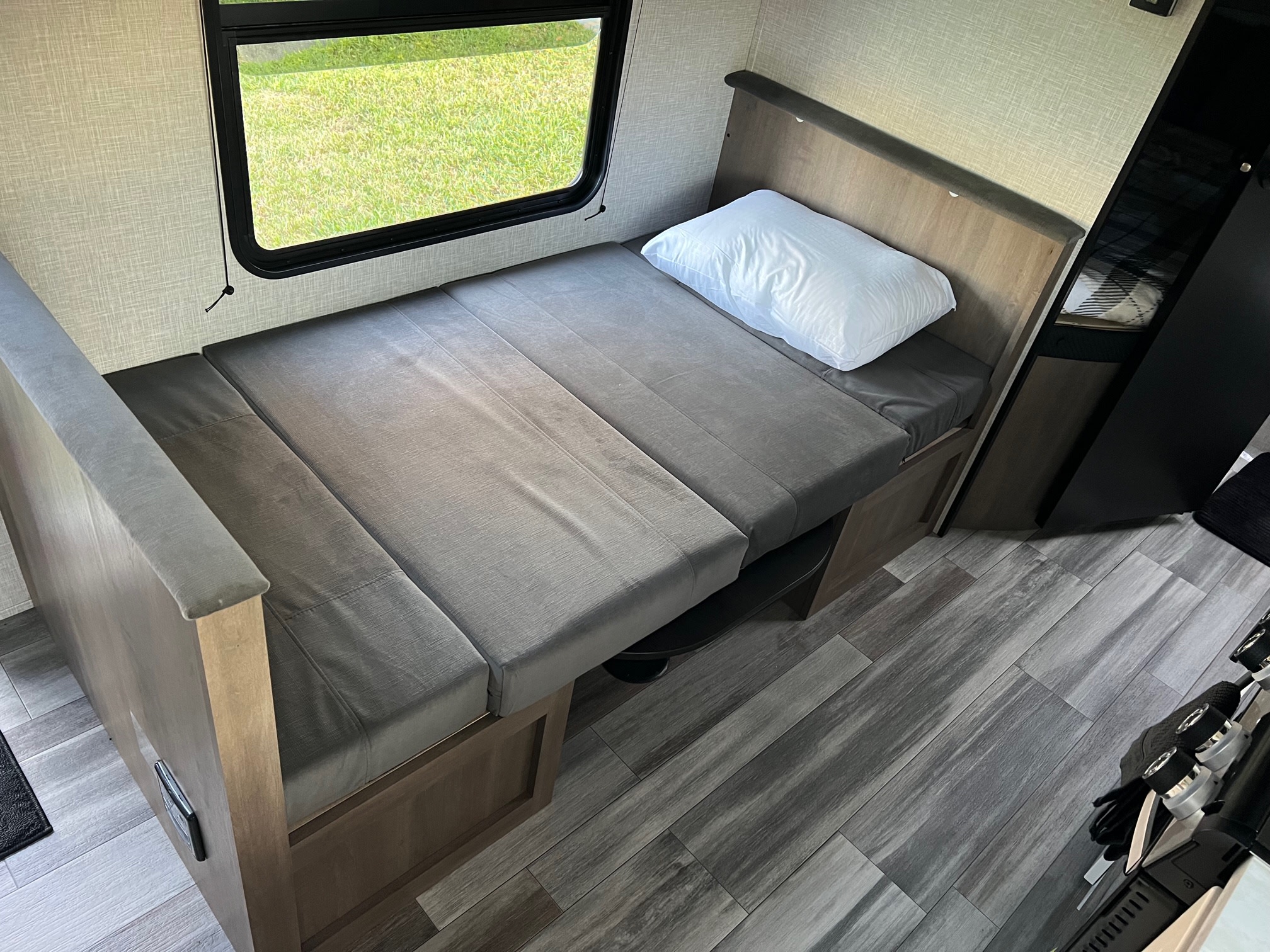 Ideal for your RV rental, this compact interior offers a convertible bed/dinette, window, and stylish wood-look floor.. Jayco Jay Flight SLX 260BH 2025