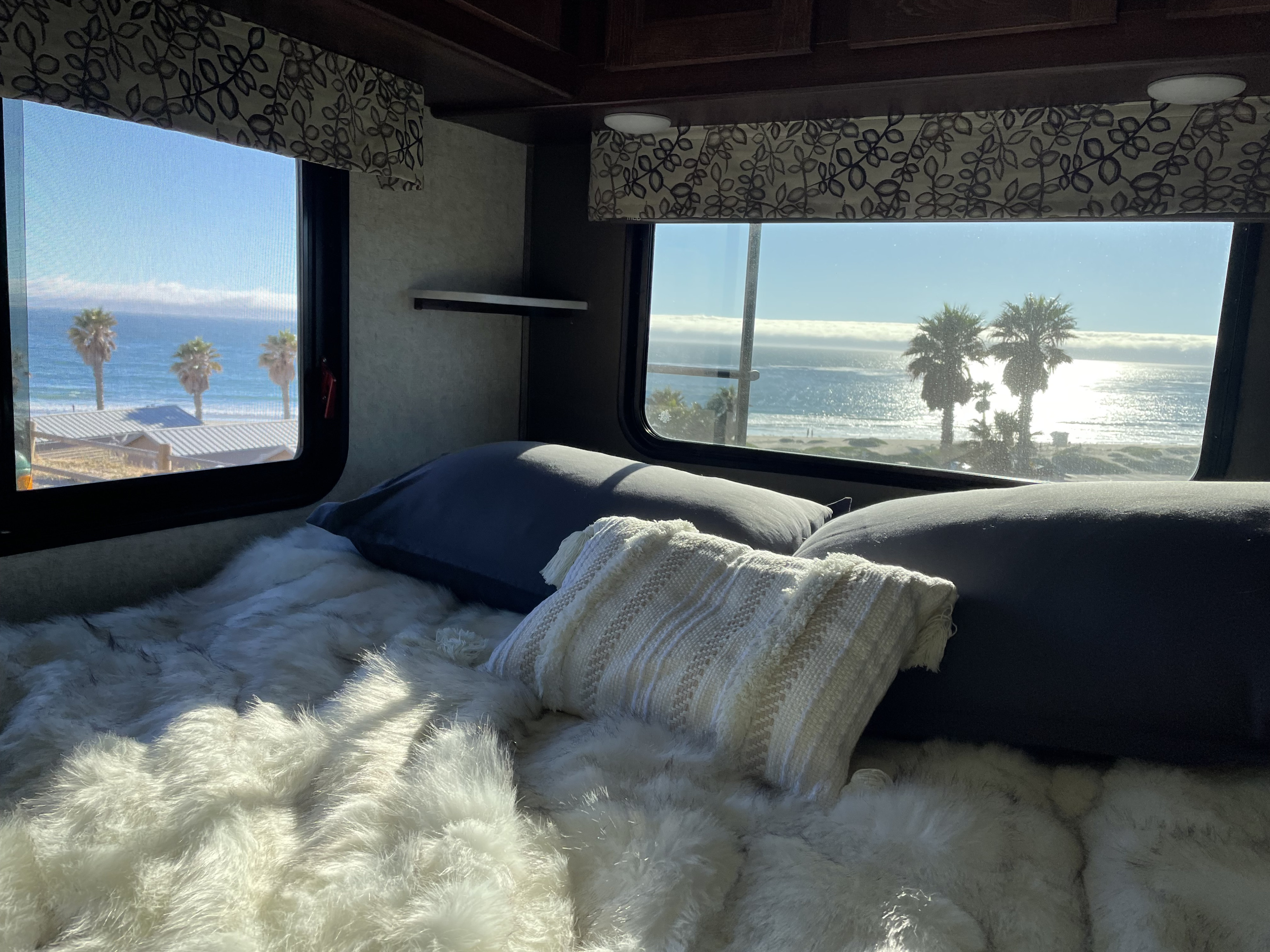 Cozy RV rental with ocean, beach, and palm tree views from bed. Ideal for a coastal retreat.. Forest River Forester Classic 2291S 2020