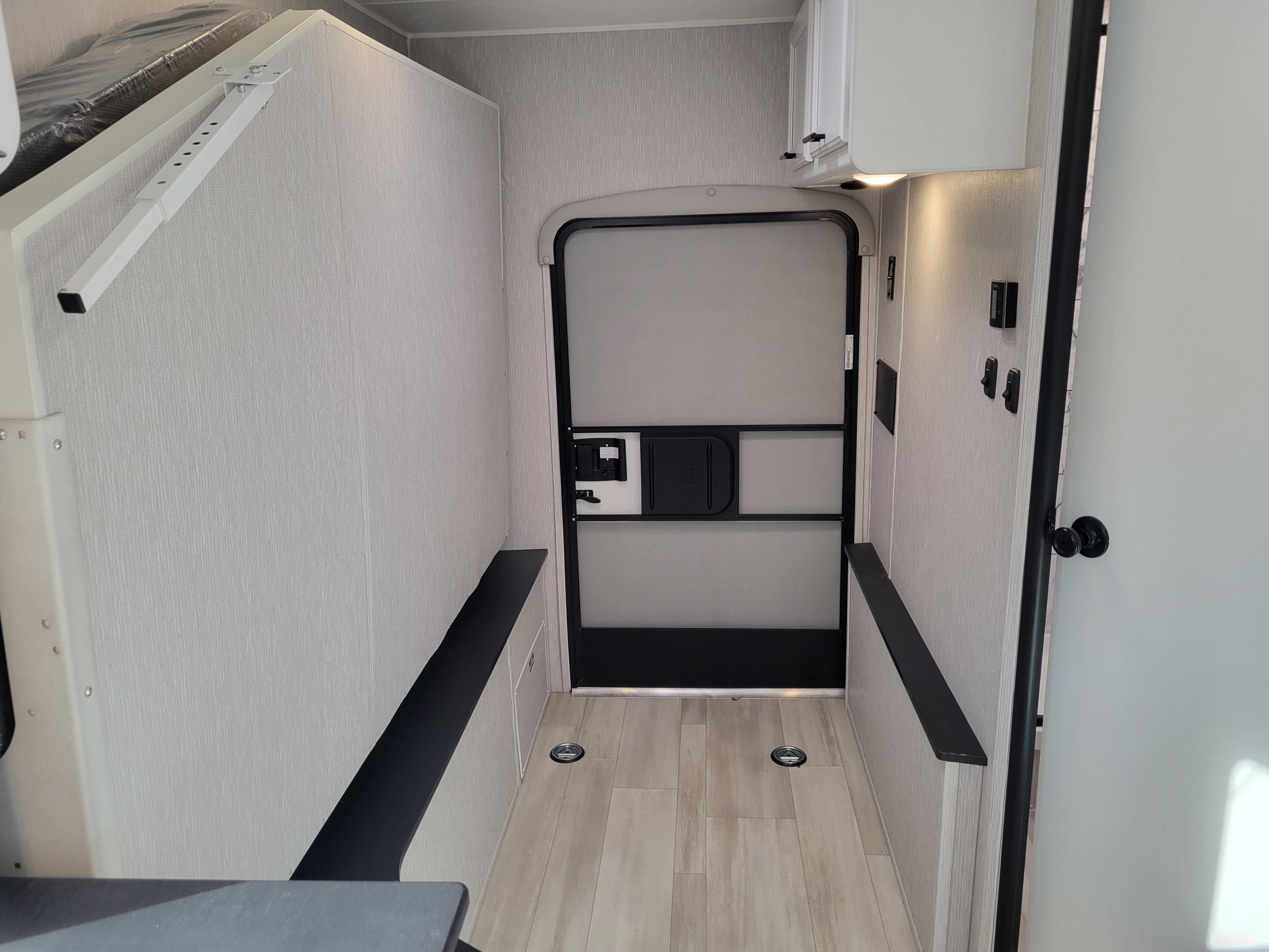 RV rental: Versatile interior shows convertible bed, benches, tie-downs & rear door for cargo/living.. Forest River Cross Trail 21XG 2023