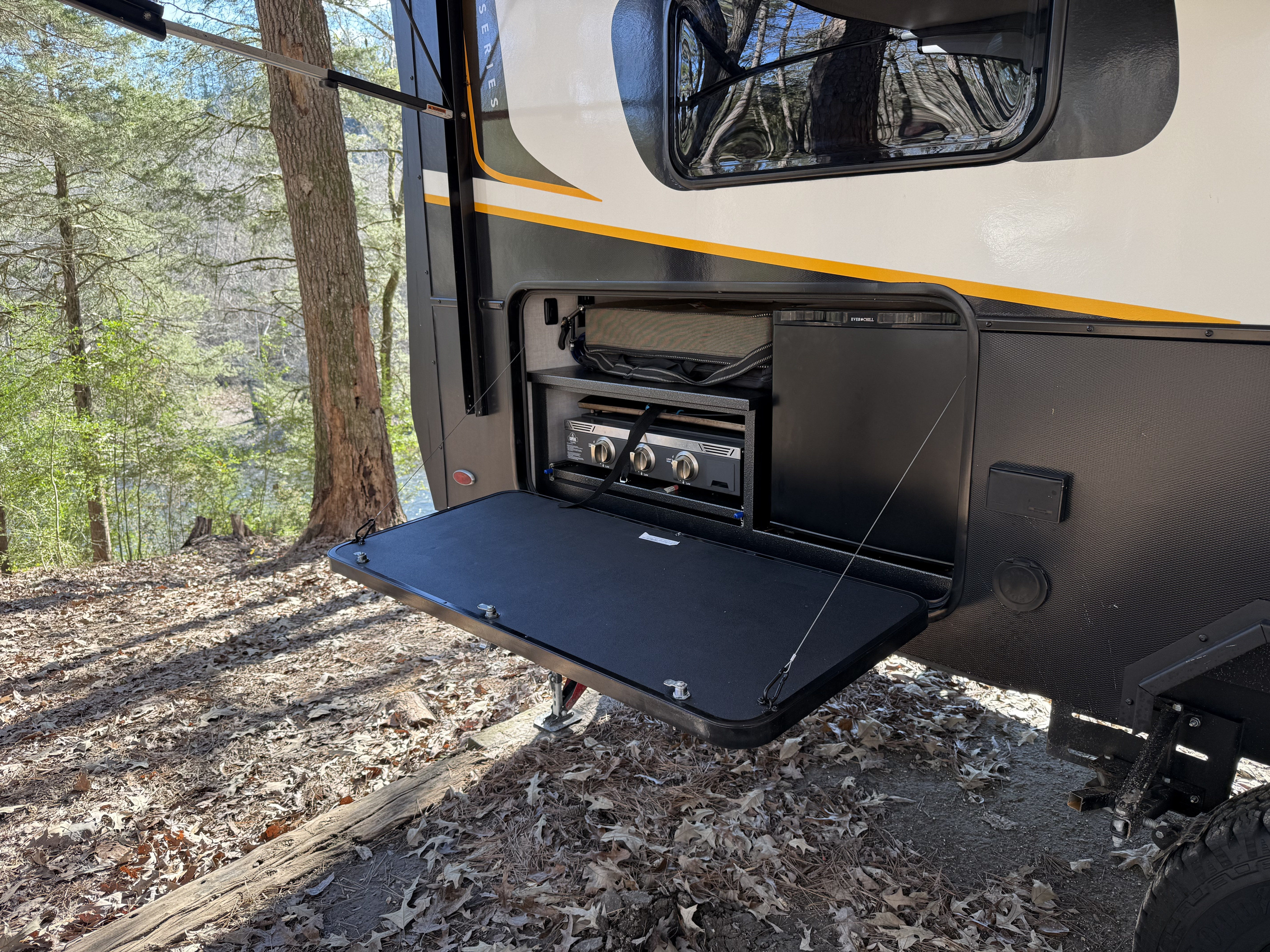 Outdoor kitchen with two-burner griddle and prep counter