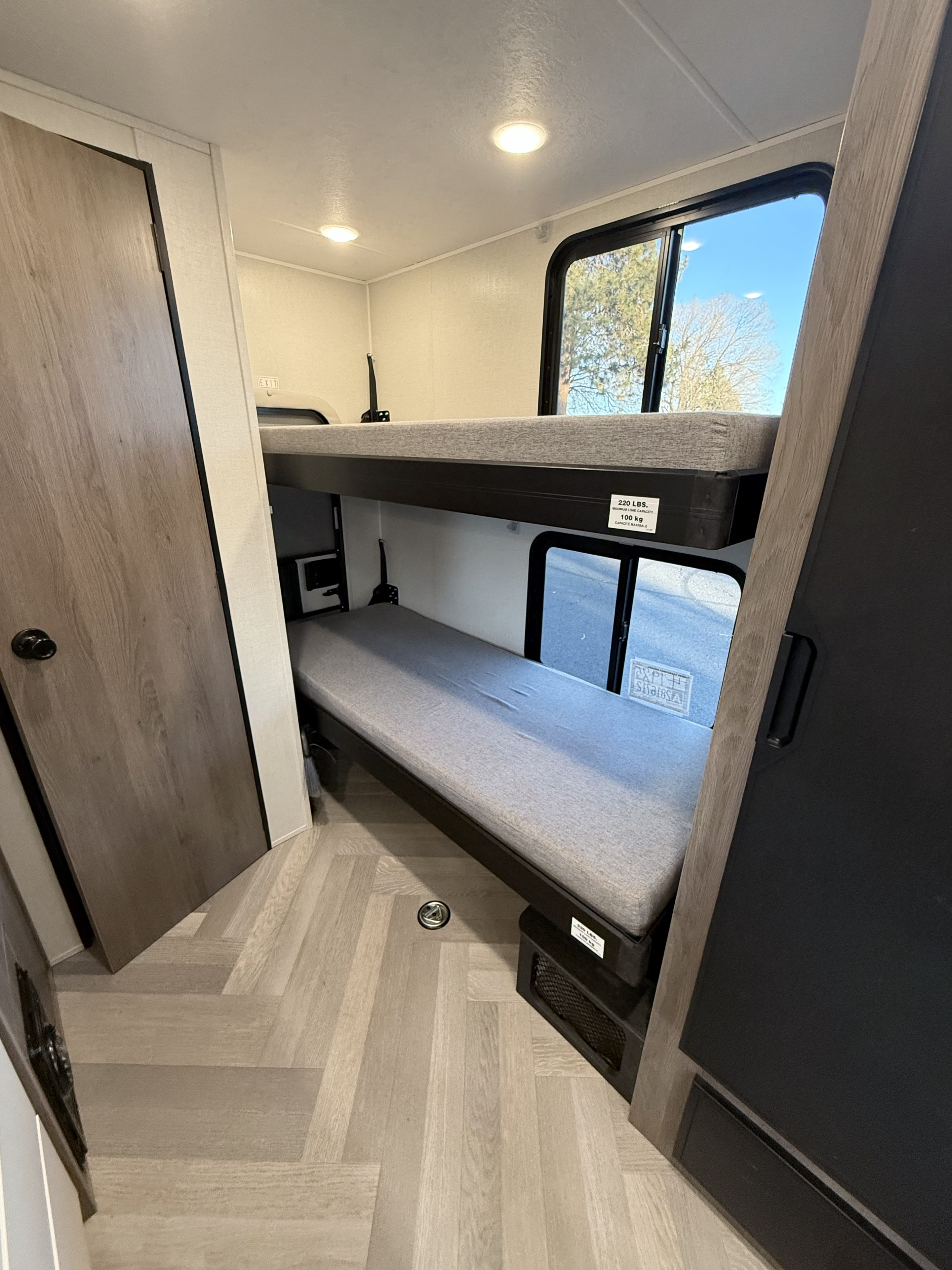 Cozy bunk beds inside an RV rental with a 220 lbs capacity per bunk, perfect for family sleeping.. Coachmen cross trail, 20 Bunkhouse, Camper Van, Class B 2024