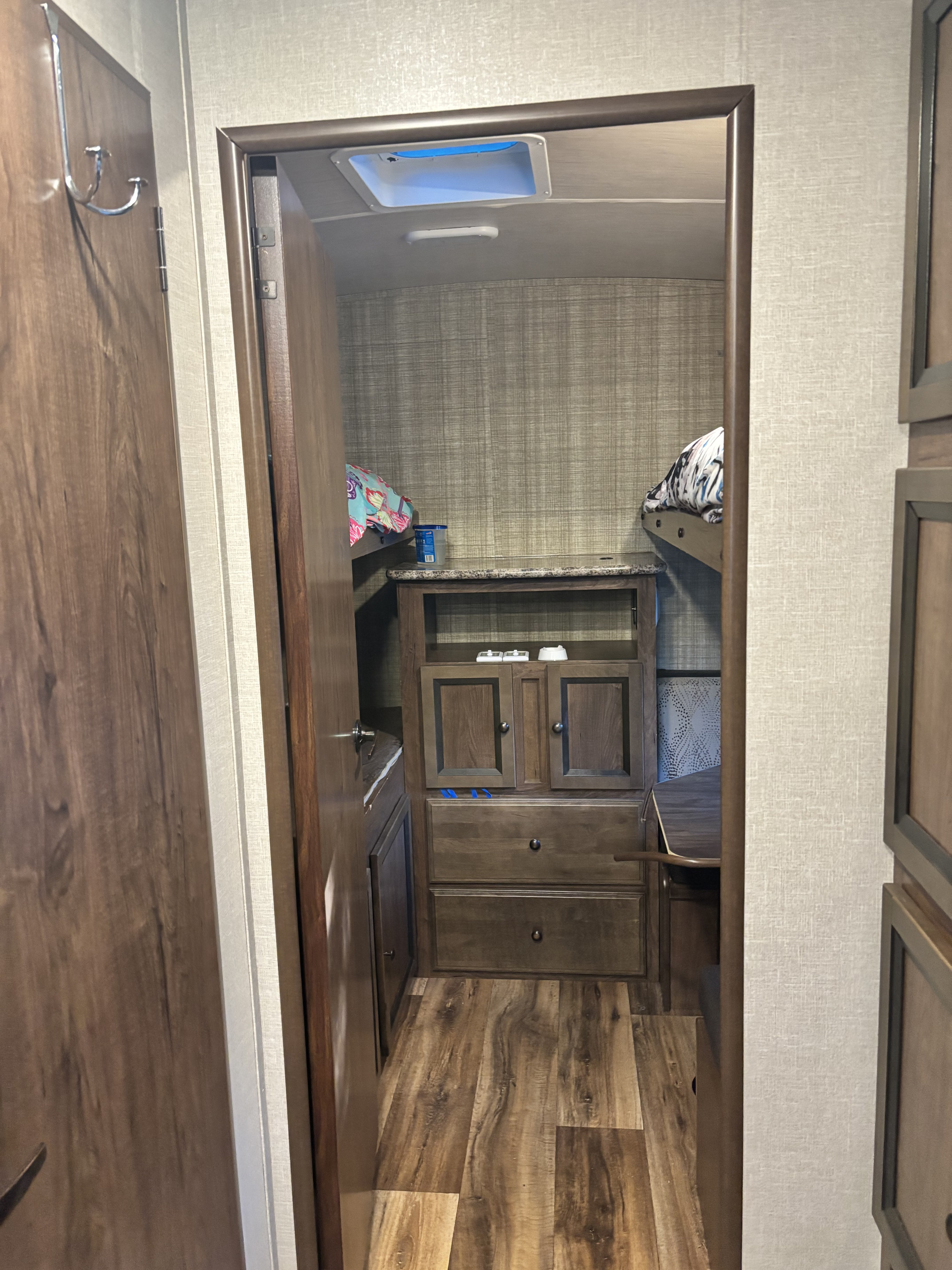RV rental interior: bunkhouse with ample storage, desk, and cozy beds for a comfortable travel experience.. Cruiser Rv Corp Cruiser 2017