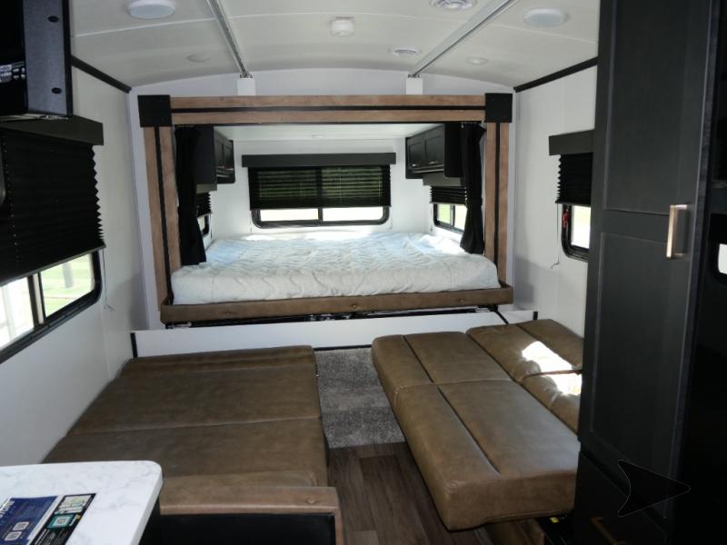 This RV rental's versatile interior features a queen bed in the rear and two sofa sections below.. Keystone RV Outback Ultra-Lite 2022