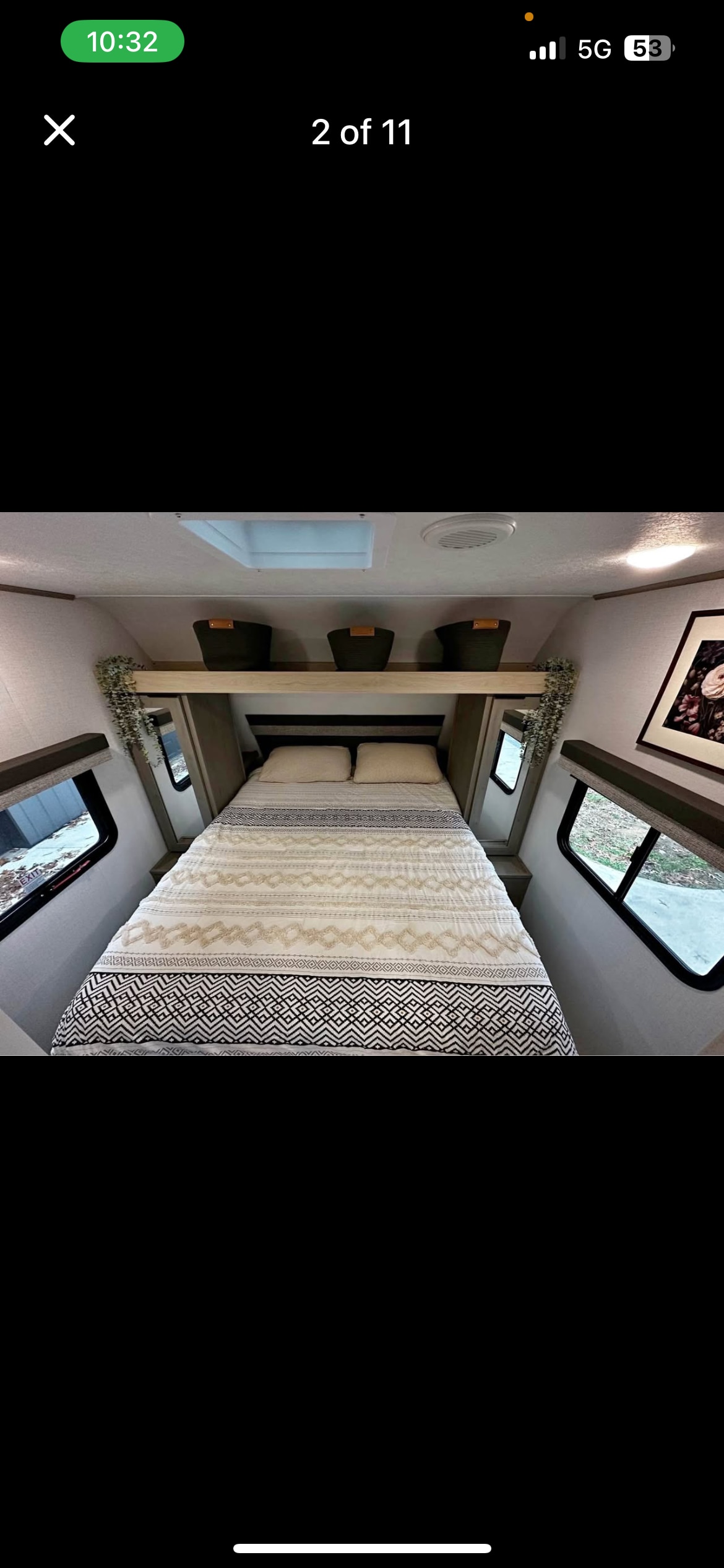 Bright RV rental bedroom: Features a patterned bed, overhead storage, and side windows.. Dutchmen Kodiak SE 2024