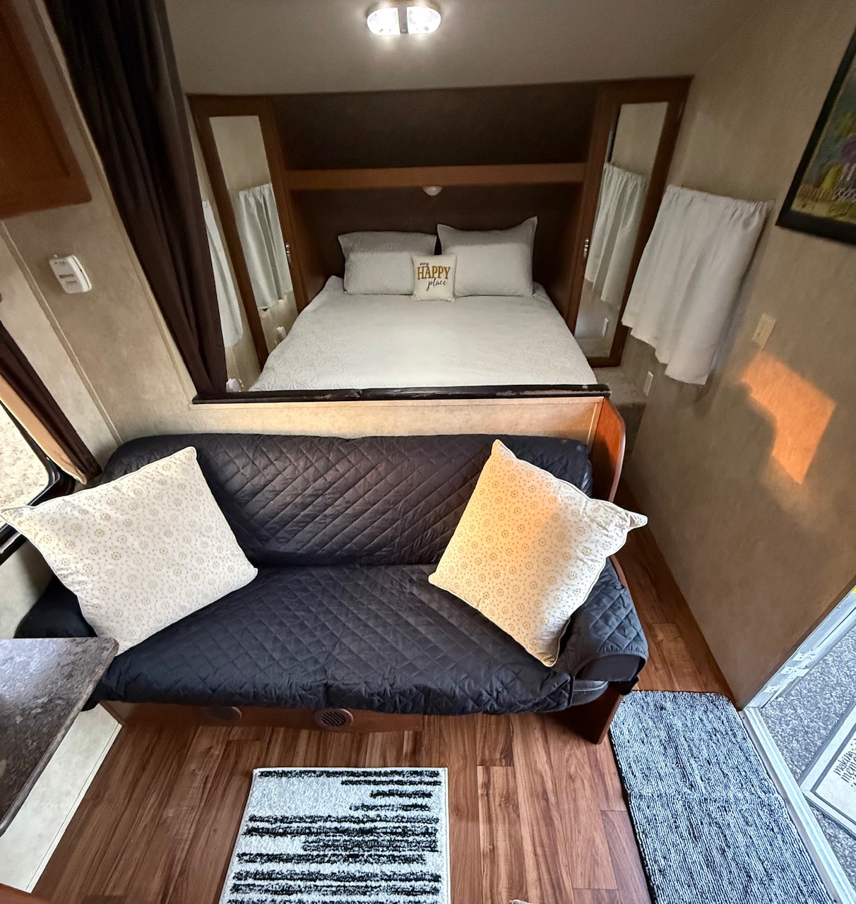 This RV rental offers a comfy bed, convertible sofa, and wood flooring, designed for a cozy journey.. Forest River Wildwood X-Lite 2015