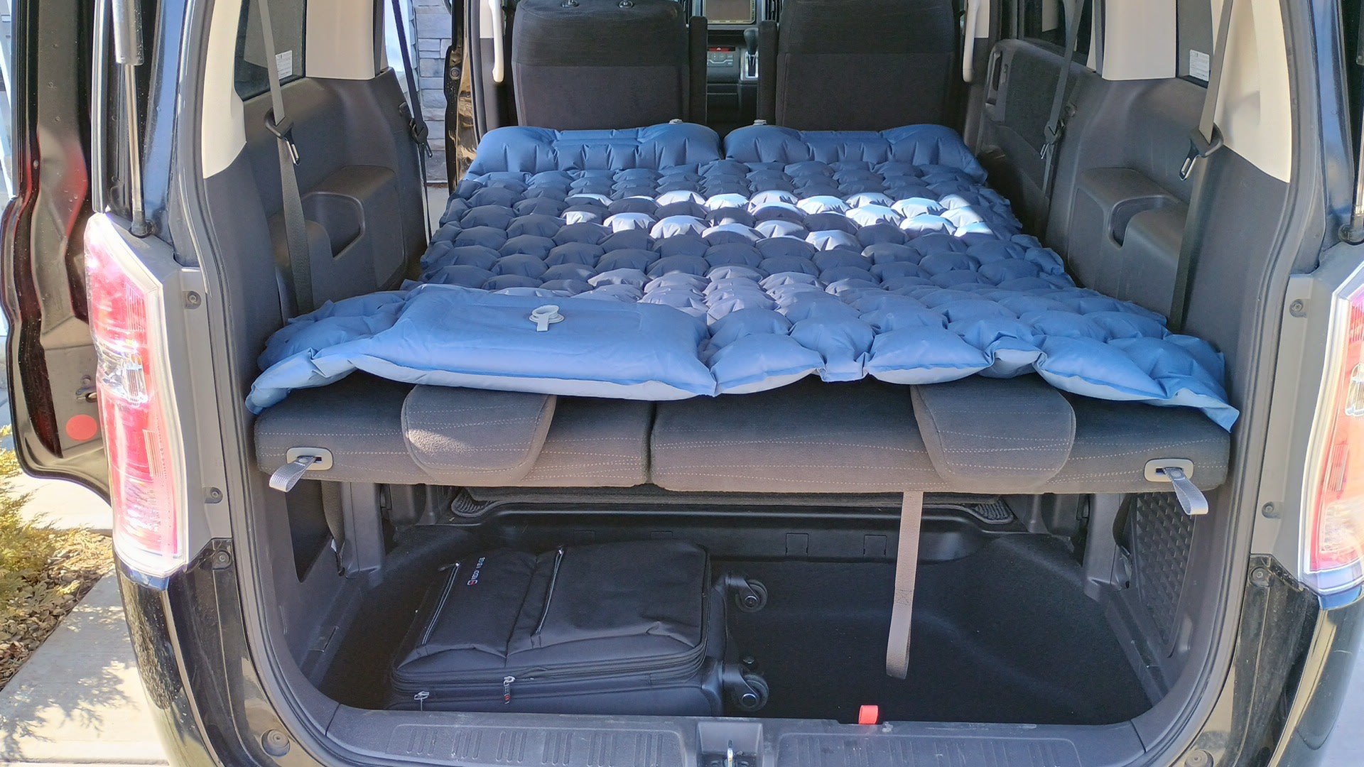 Inside a vehicle, an inflatable mattress creates a comfortable sleeping setup, ideal for your next RV rental adventure.. Universal Transformer 2009