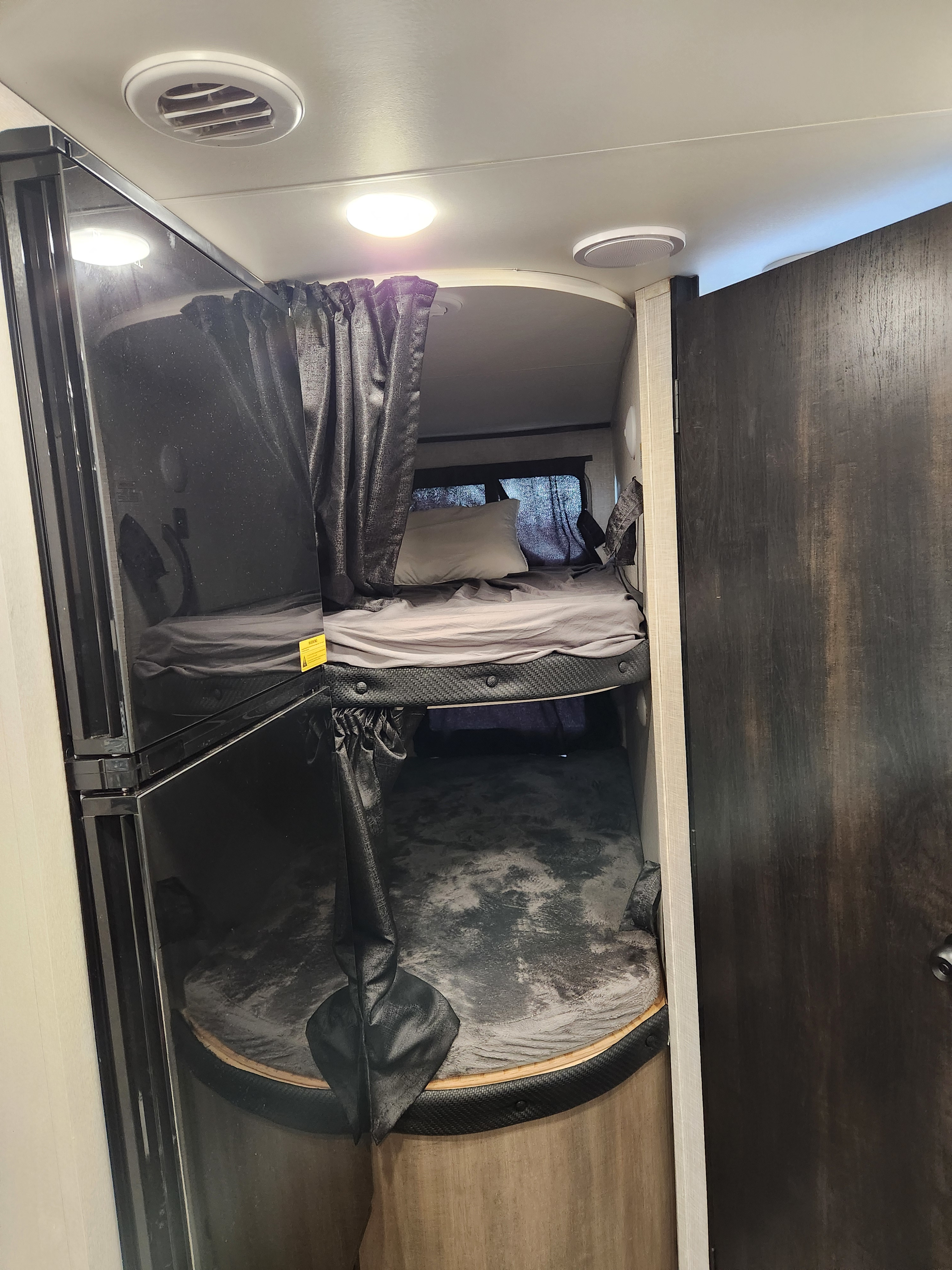 Cozy stacked bunk beds with privacy curtains in an RV rental. Ideal sleeping space for travel trailer adventures.. Jayco Jay Flight 2024