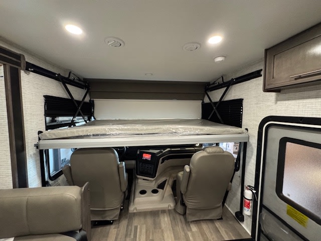 RV rental interior: Drop-down bunk bed over cockpit. Maximizing space for travelers.. Jayco Alante 2025