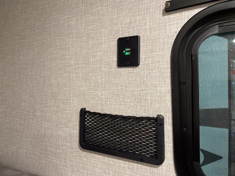 Stay charged in your RV rental with dual USB ports and a handy mesh pocket on the wall, next to a window.. Other Other 2025