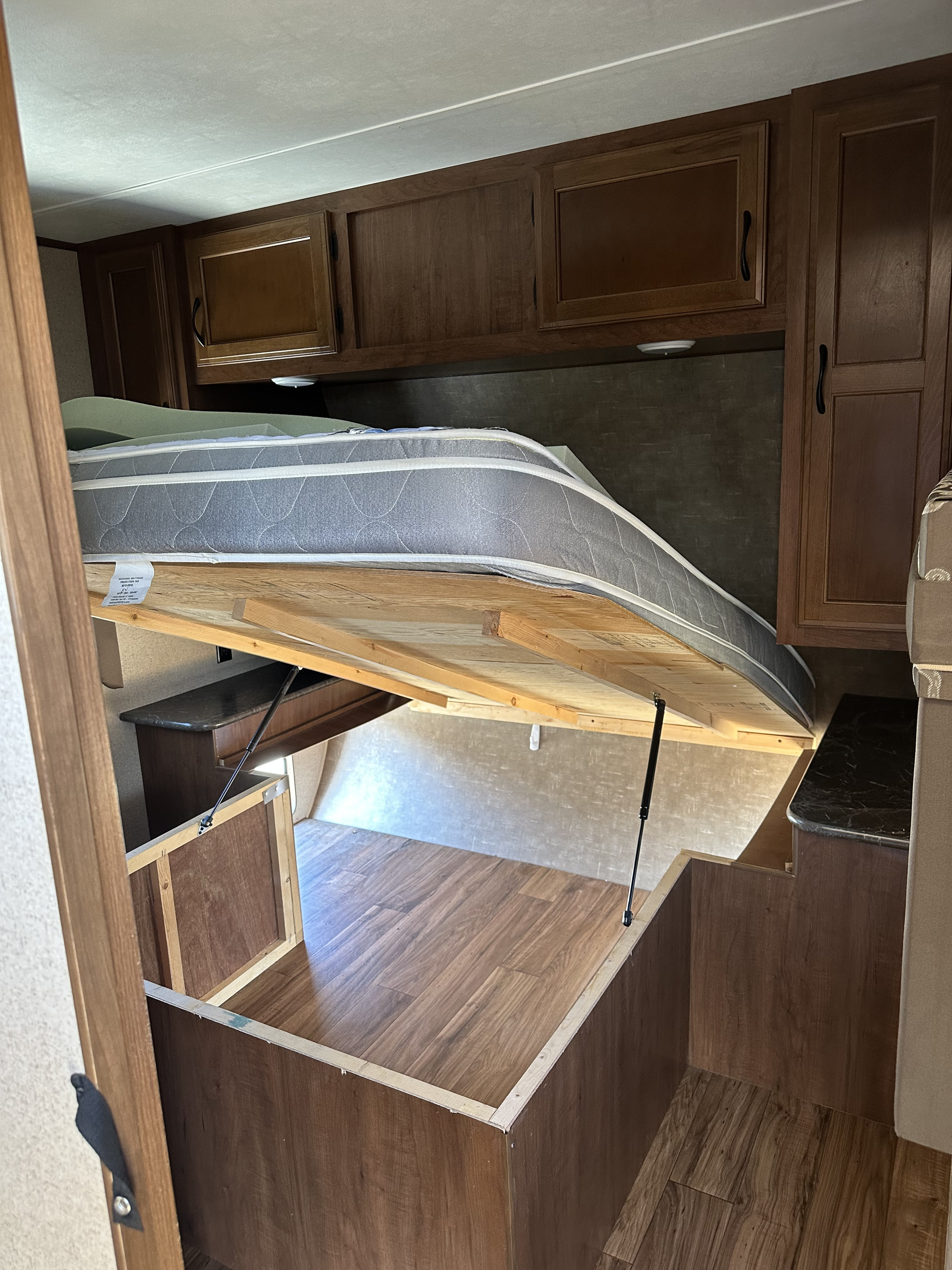 RV rental bedroom: mattress lifted to reveal vast under-bed storage, ideal for maximizing space when traveling or camping.. Jayco Jay Flight 2016