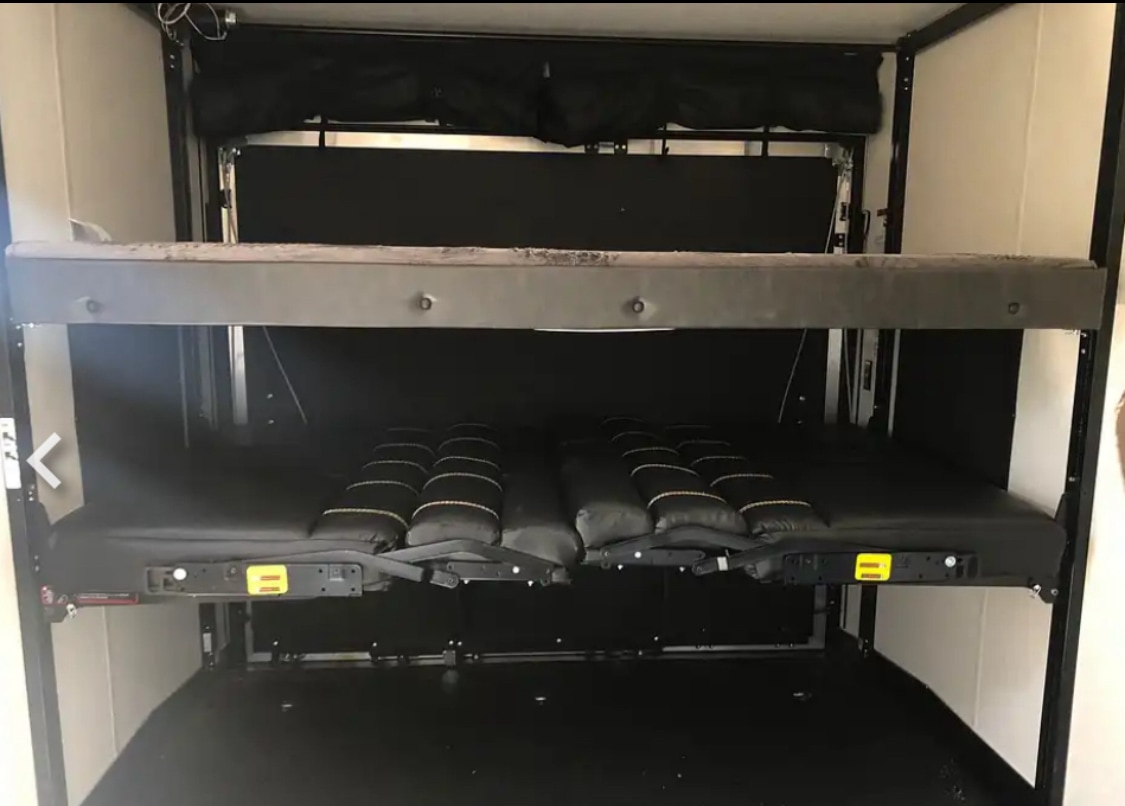 RV rental: Interior with adjustable bunk beds & convertible seating. Flexible space for sleeping & cargo.. Forest River Cherokee Wolf Pack 2022