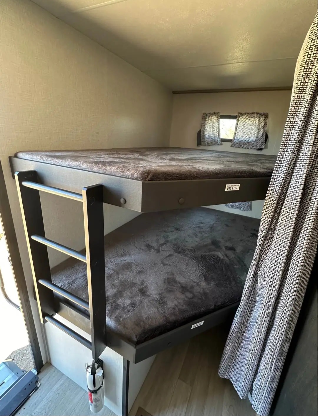 Enjoy family adventures! This RV rental features cozy bunk beds with dark mattresses & a fire extinguisher for safety.. KZ Connect C251BHK 2023