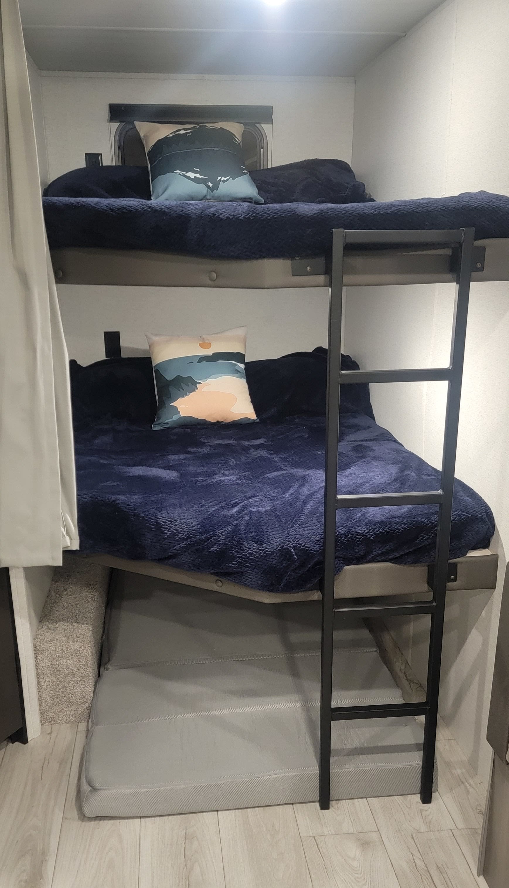 Cozy RV rental bunk beds with a lower convertible sleep area for family adventures.. Keystone 261BH 2025