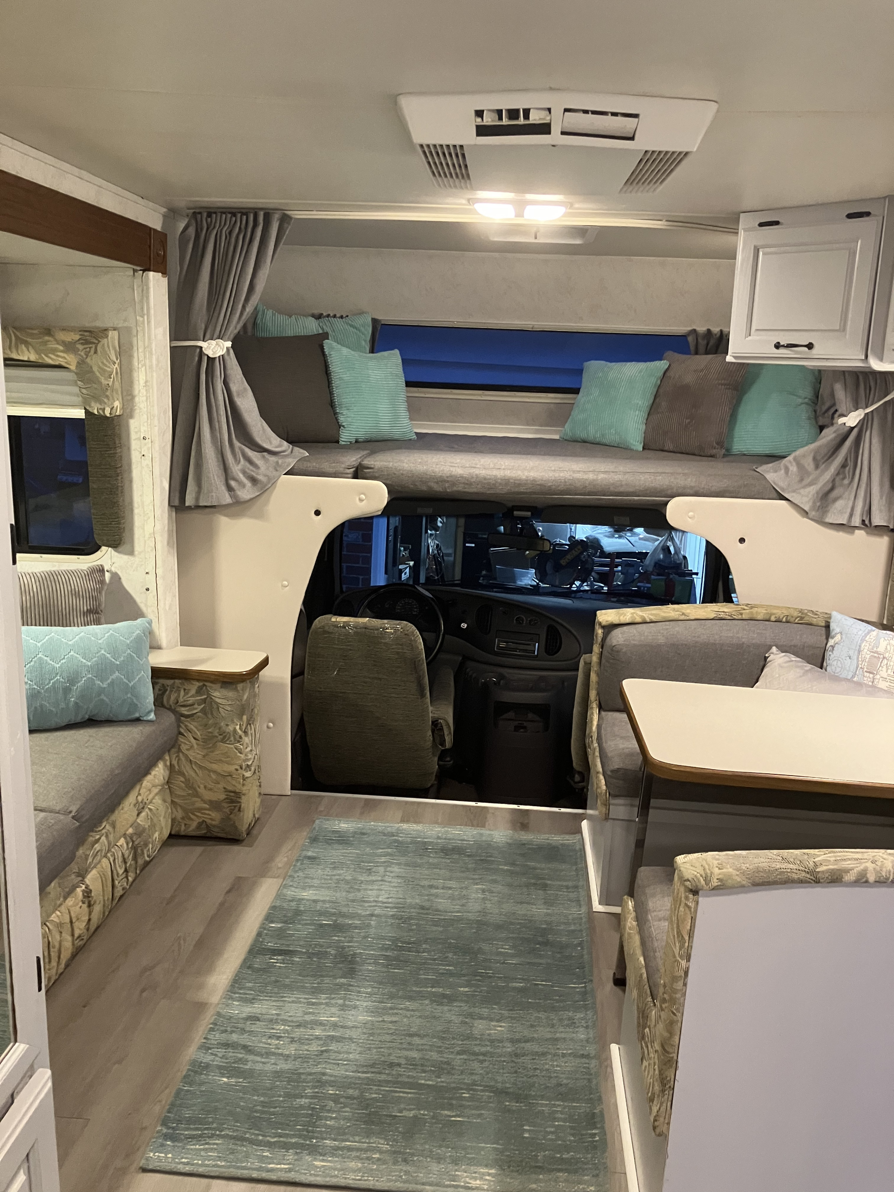Step inside this inviting RV rental: cab-over bunk, dinette, and driver's cabin for your next road trip.. Dutchmen Other 2001