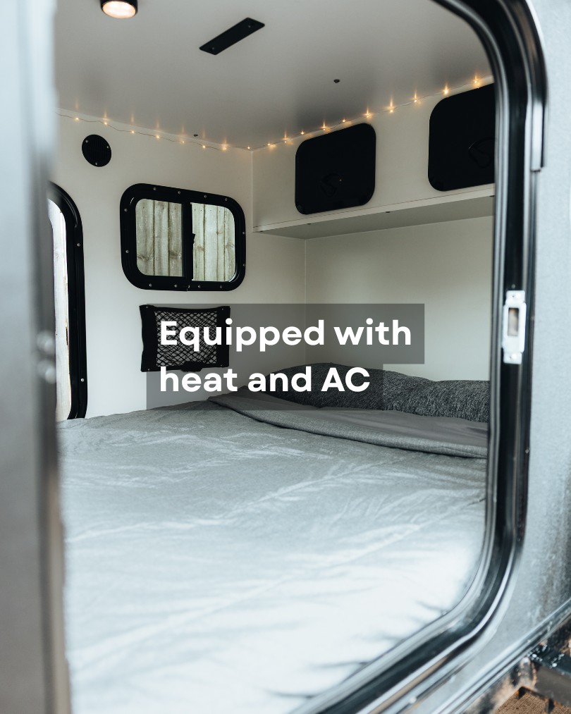 RV rental interior features a comfy bed, window, storage, heat, and AC for your travels.. Other Other 2022