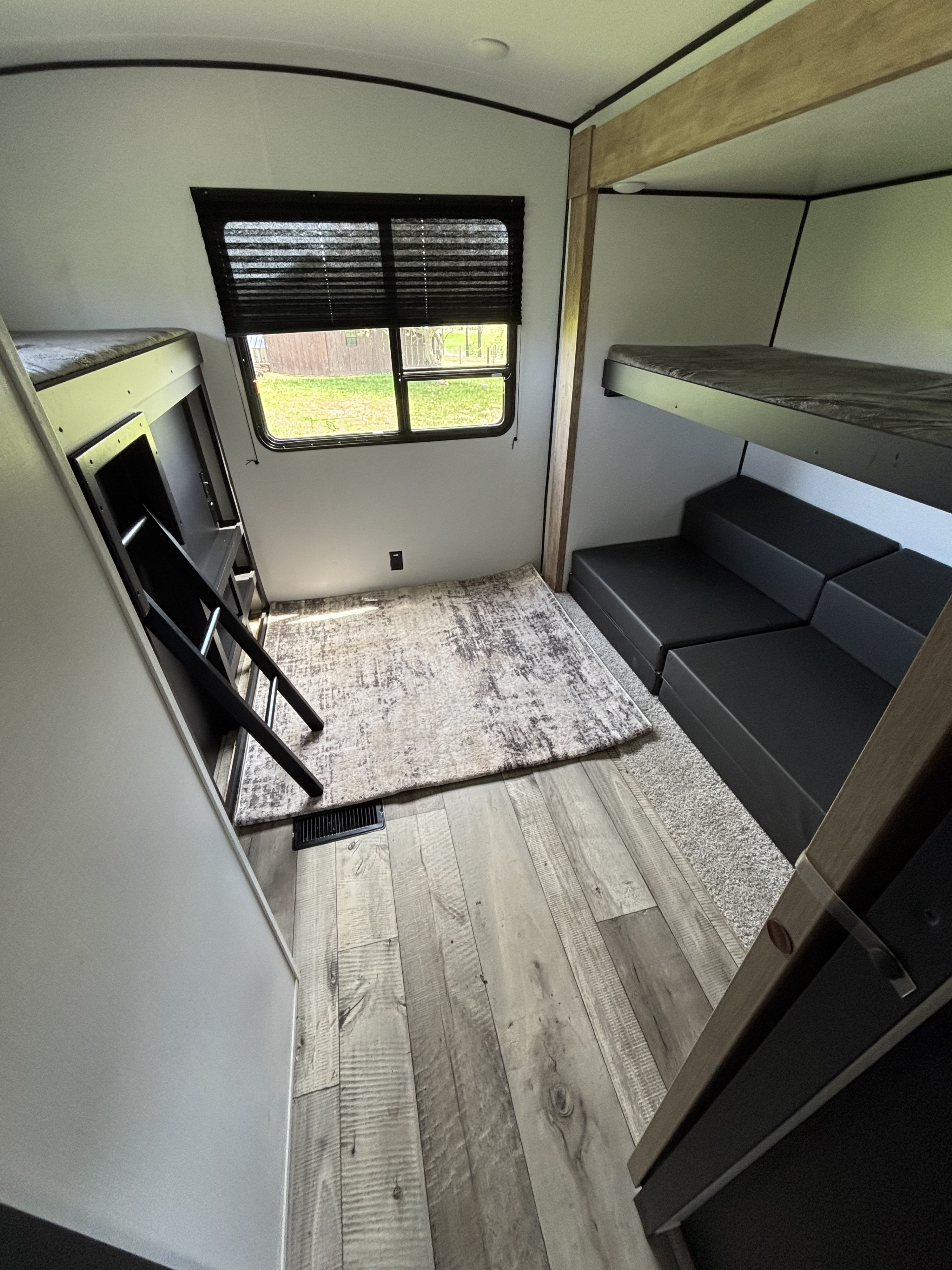 This inviting RV rental bunkhouse features multiple beds, including a top bunk with ladder, and flexible lounge seating, ideal for groups.. Keystone Spring Dale 2022