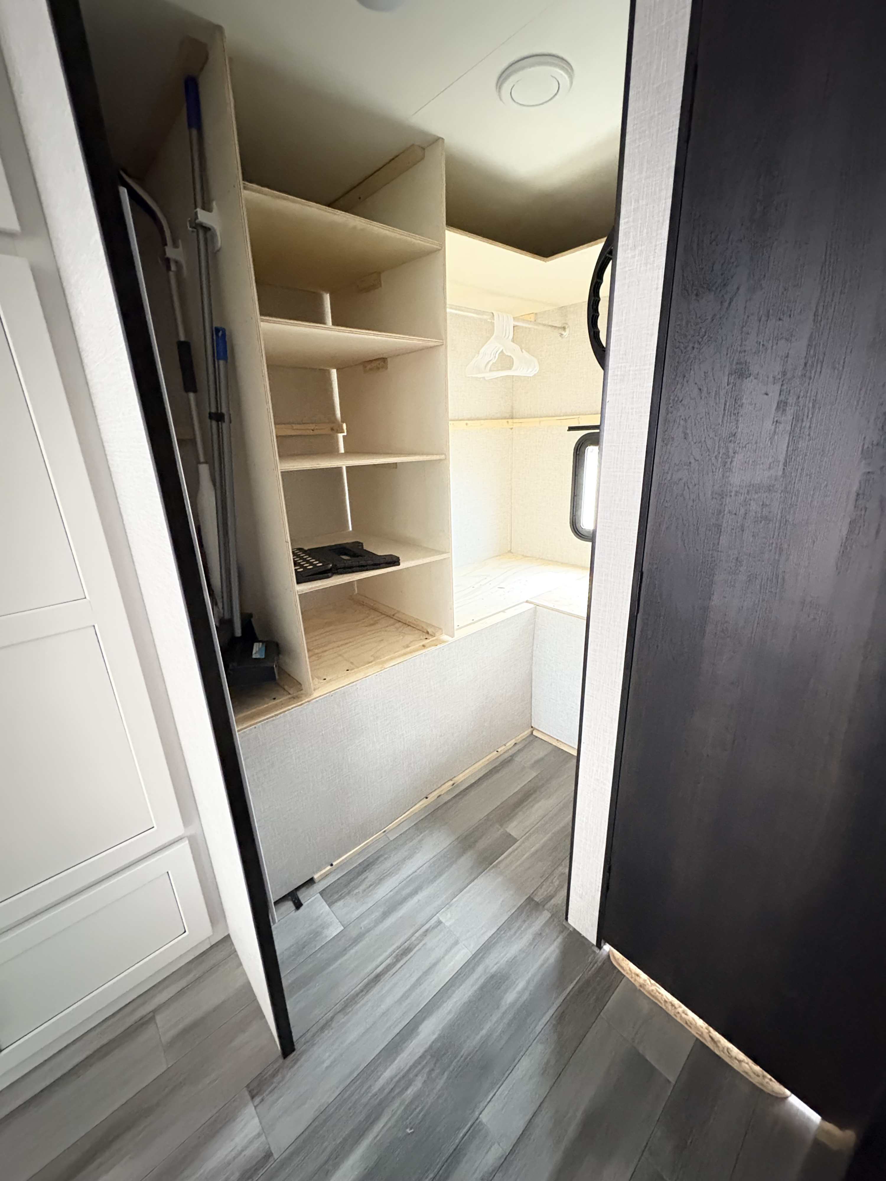 RV rental interior with smart storage: custom shelves, a compact closet, and a cleaning tool nook.. Jayco Jay Flight SLX 2024