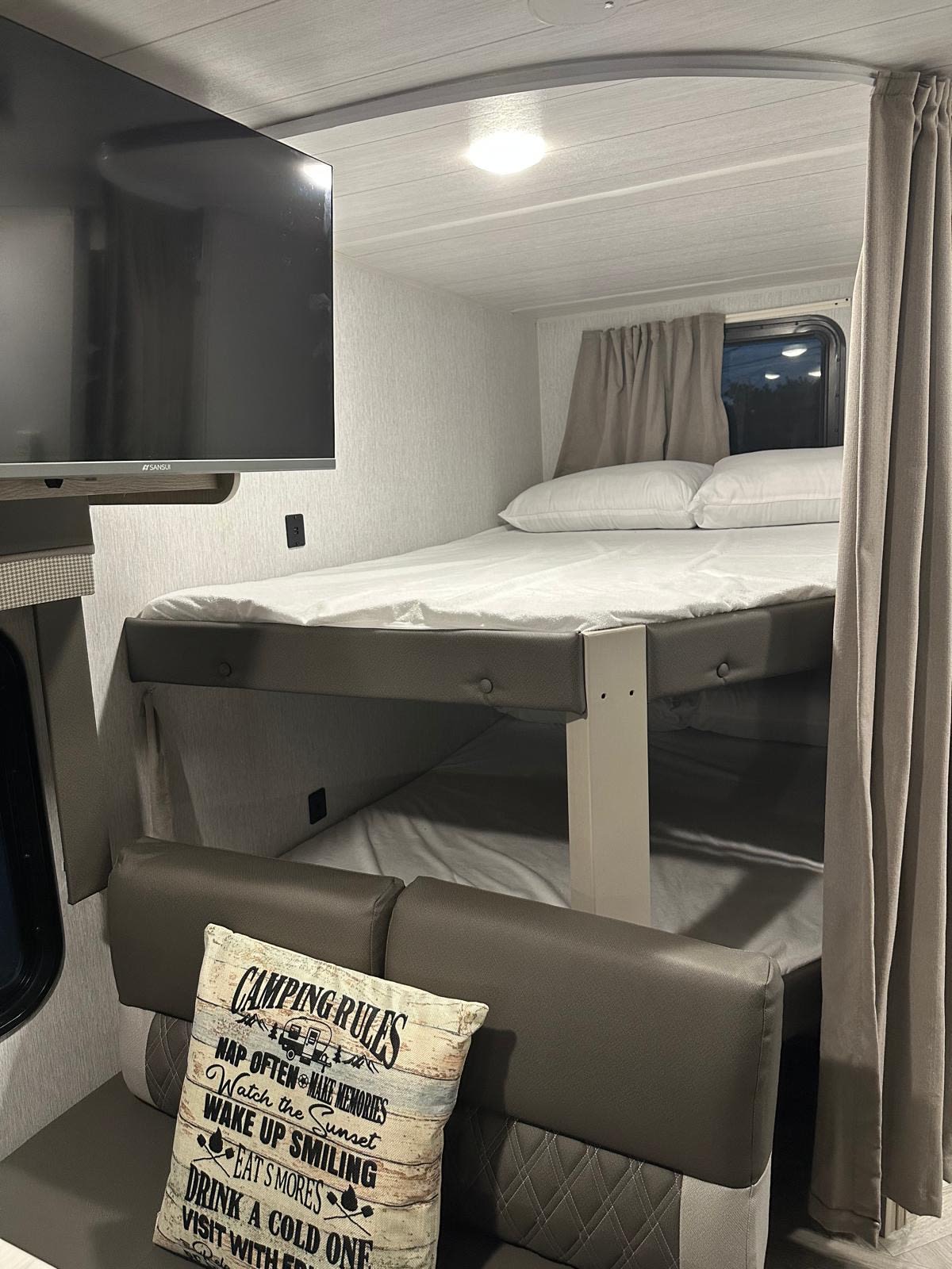This rv rental bunkhouse offers comfortable bunk beds, a TV, and seating, making it perfect for your next family camping trip.. Forest River Salem Cruise Lite 2023