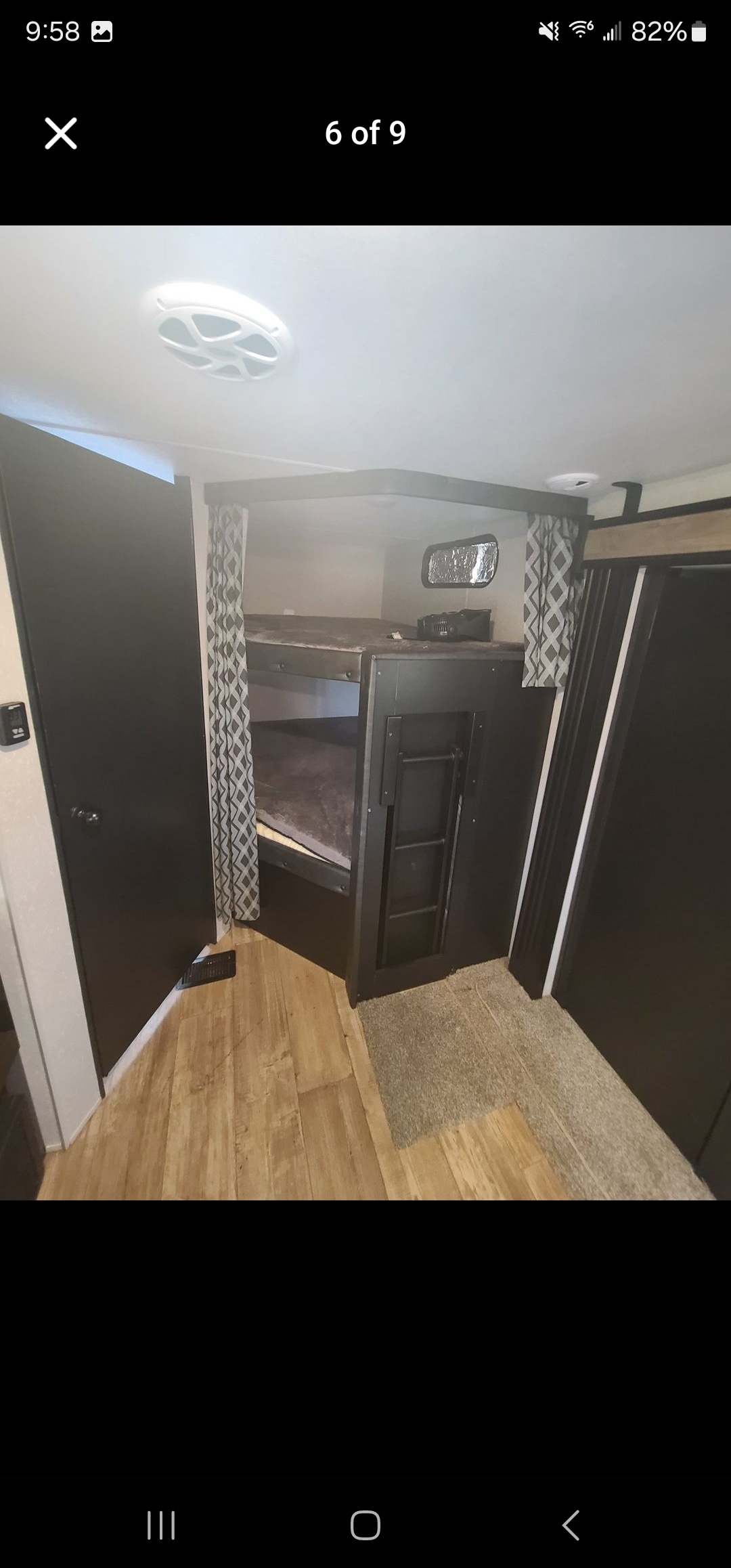 RV rental bunkhouse: A view of the double bunk beds with privacy curtains and a window, ideal for extra sleeping space.. Forest River Cherokee 2021