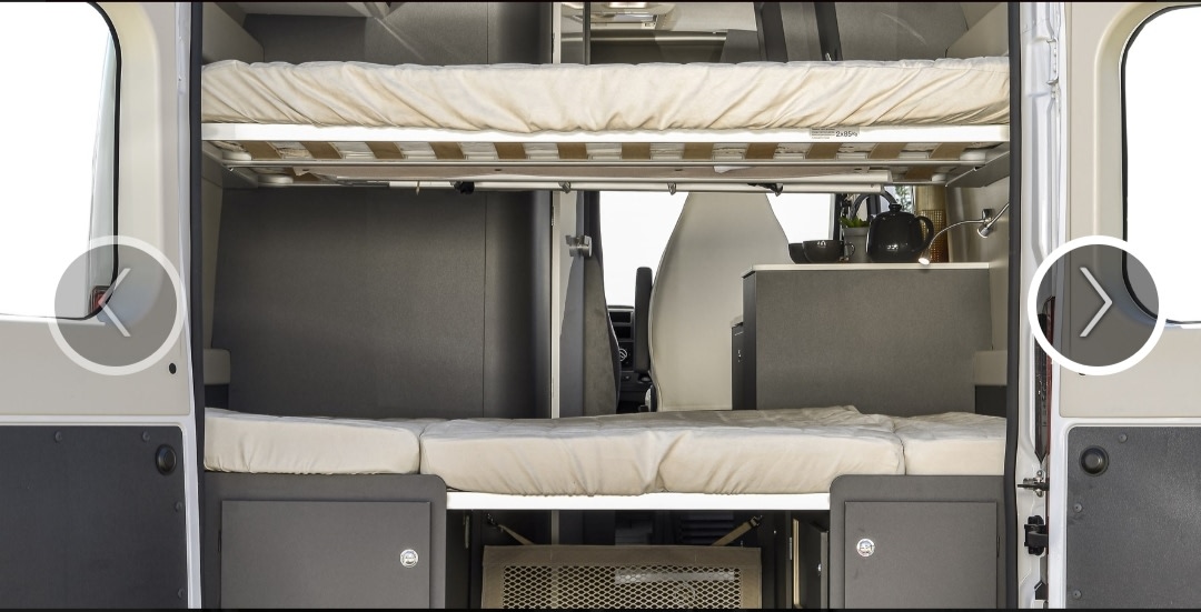 RV rental interior from rear doors: bunk beds, kitchenette, and efficient storage design.. Fiat MCLOUIS MENFYS 3MAXI 2025