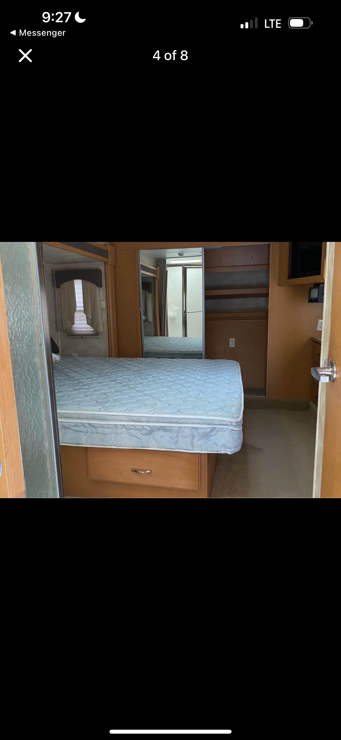 RV rental bedroom featuring a comfortable bed, ample storage, and mirrored closets. Ideal for your next journey.. Heartland RVs Cyclone Toy Hauler 2008