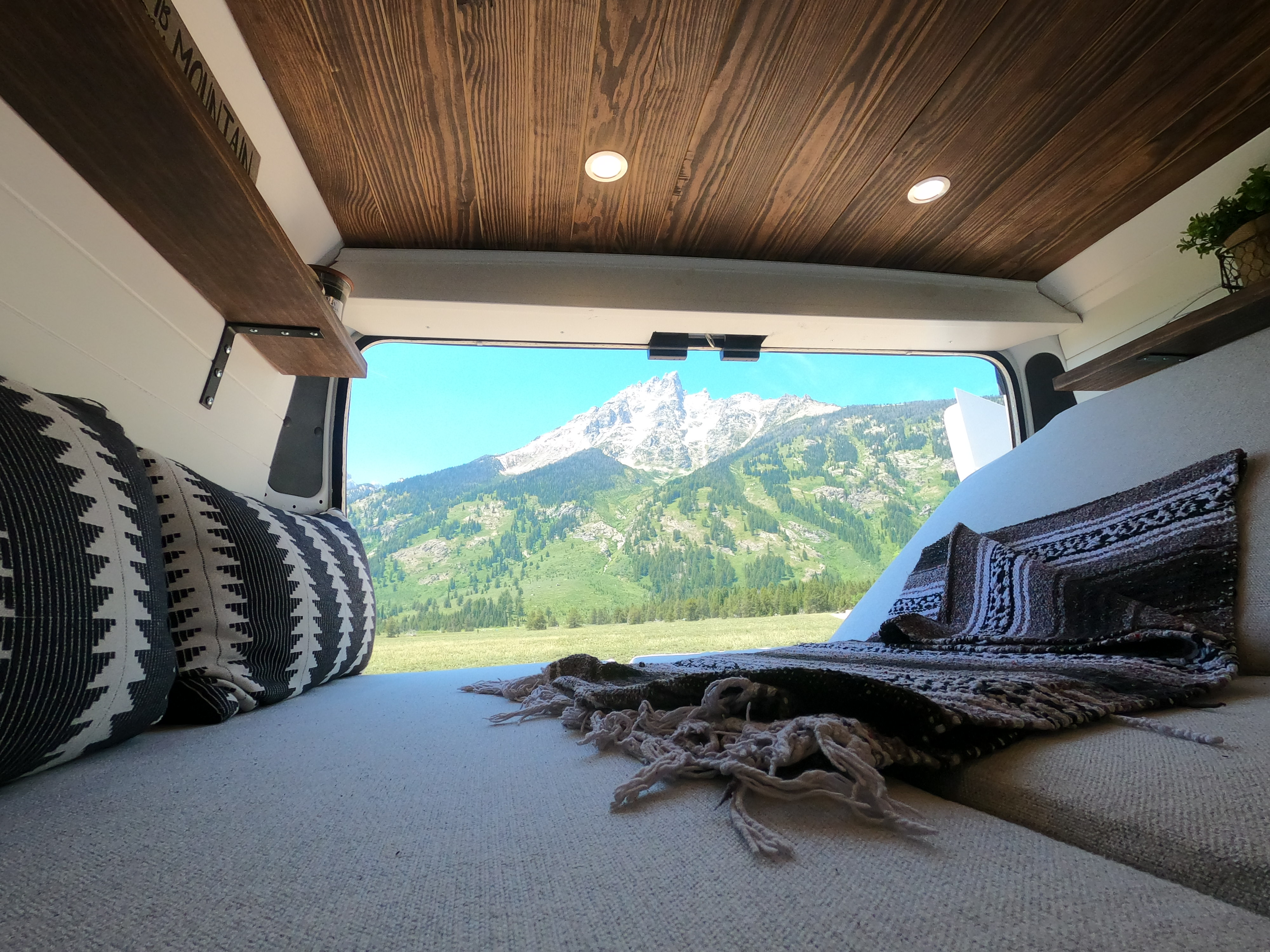 Experience serene van life! This cozy RV rental offers stunning mountain views from a comfortable interior. Perfect nature escape.. Dodge Ram 1500 2019