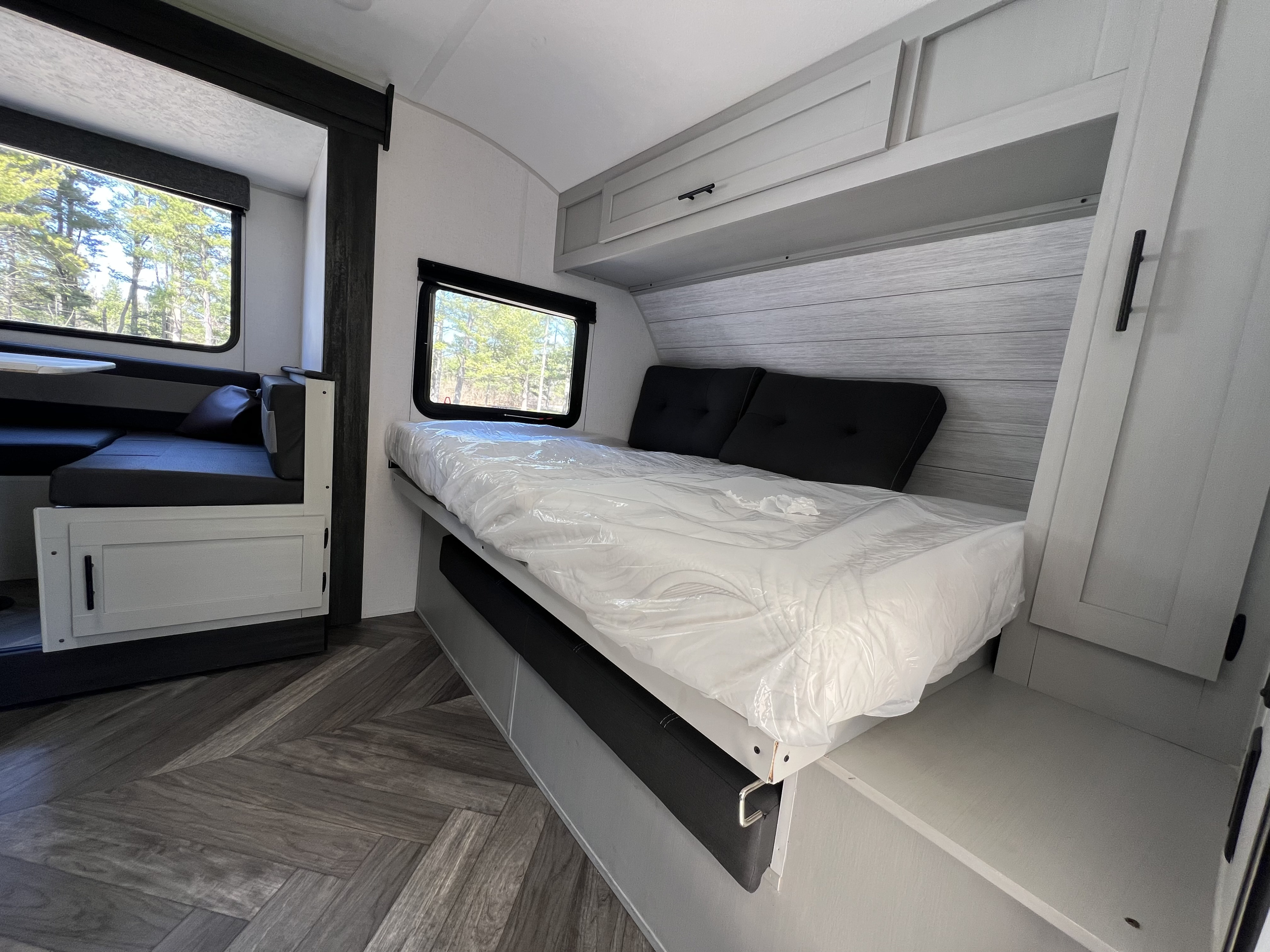 Modern RV rental features a cozy bedroom with storage & dinette area. Enjoy comfortable travels.. Forest River Salem FSX 2021