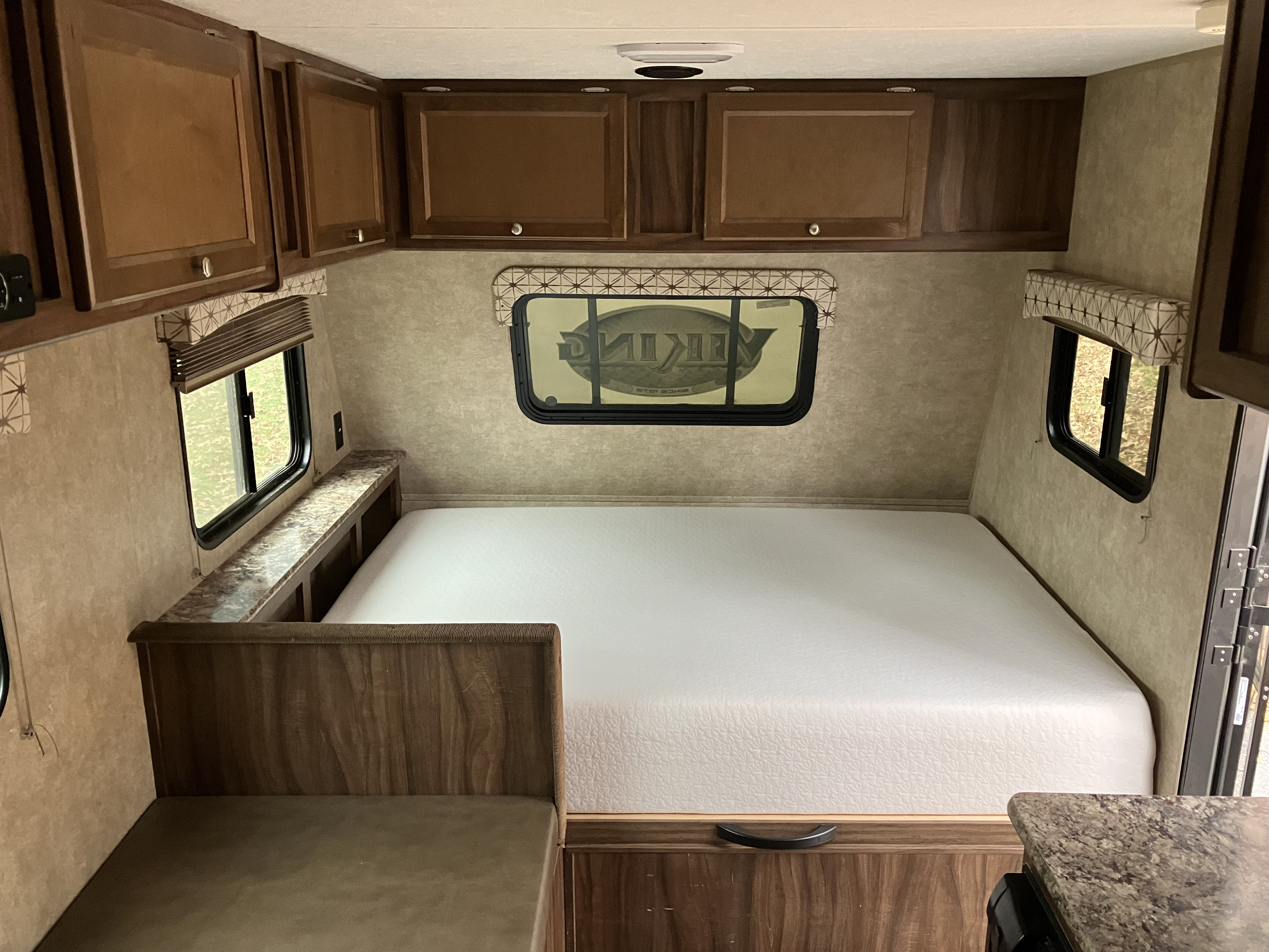 Inside this RV rental, you'll find a clean bed, small dinette, and plenty of storage in the wood-toned cabinets.. Forest River Viking 2016