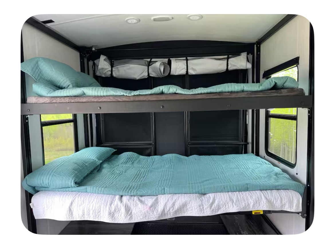 RV rental: Bunk beds provide a cozy sleeping area in this recreational vehicle. Ideal for family adventures.. Heartland RVs Torque Toy Hauler 2022