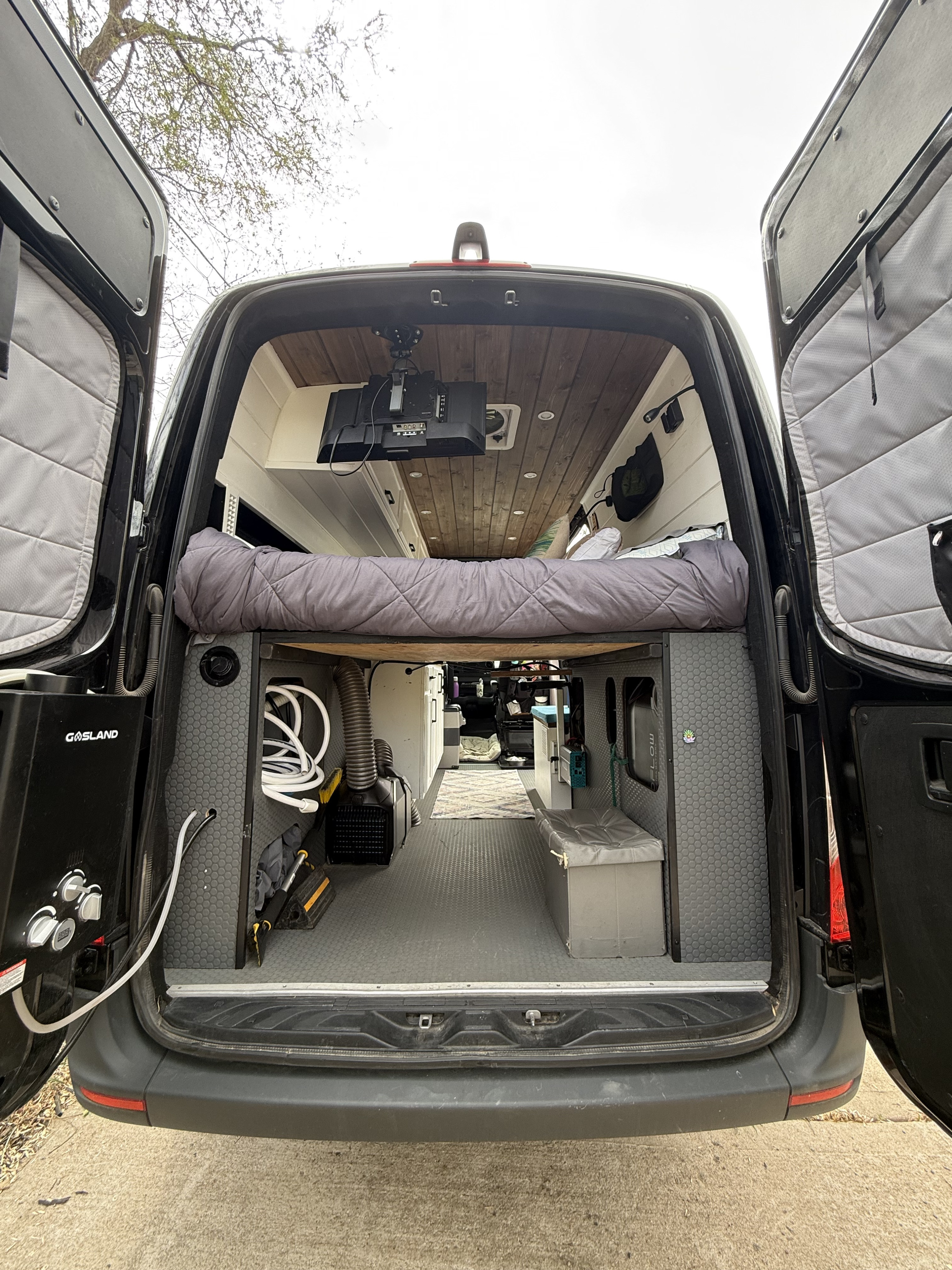Explore this custom camper van conversion, ready for adventure! Ideal for RV rental, featuring a cozy bed & ample storage.. Mercedes Sprinter 2023