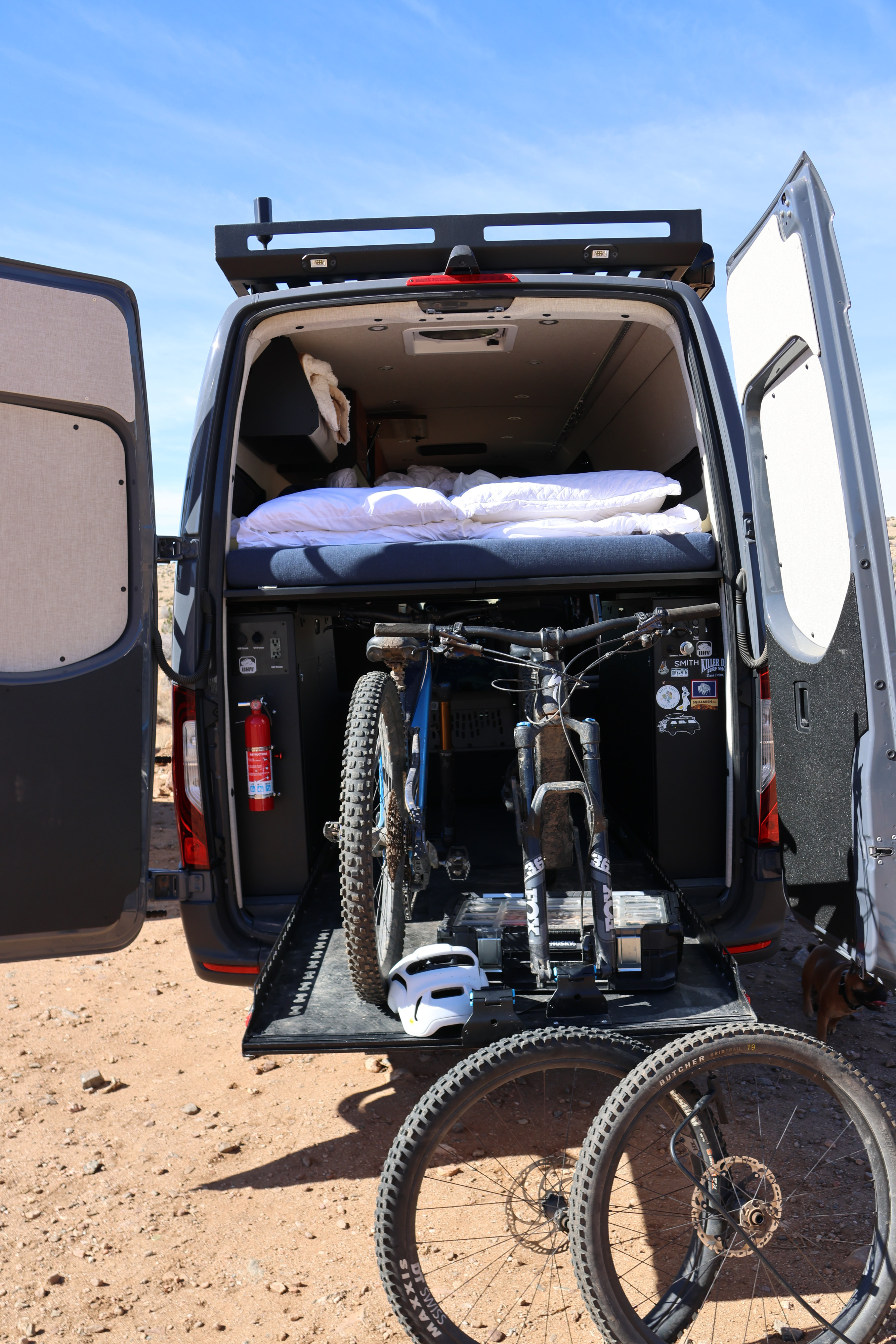 This RV rental camper van is ready for adventure! Features smart bike storage, a cozy bed, & power for off-grid trips.. Off Highway Van Off Highway Van Class B 2023