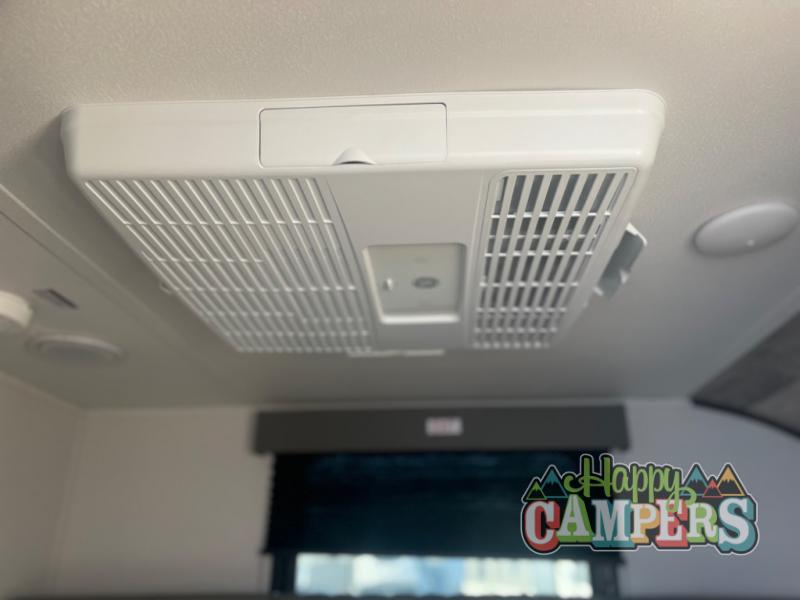 Stay cool in your RV rental with this ceiling-mounted air conditioner. Essential for comfortable road trips.. Riverside RV Intrepid 2023