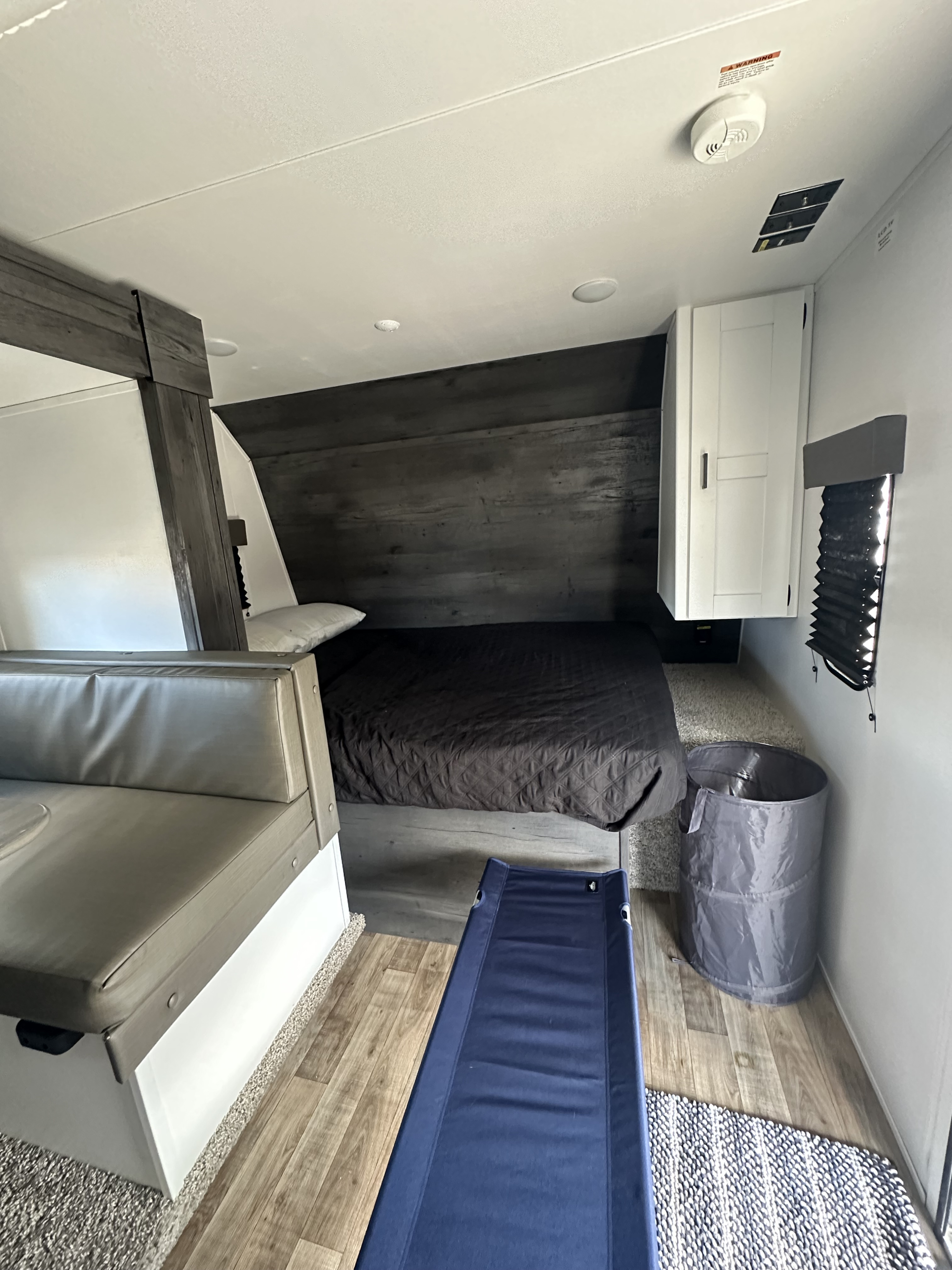 Experience comfort in this RV rental! Features a modern bedroom, dinette, extra cot, and ample storage.. Keystone RV Hideout 2022