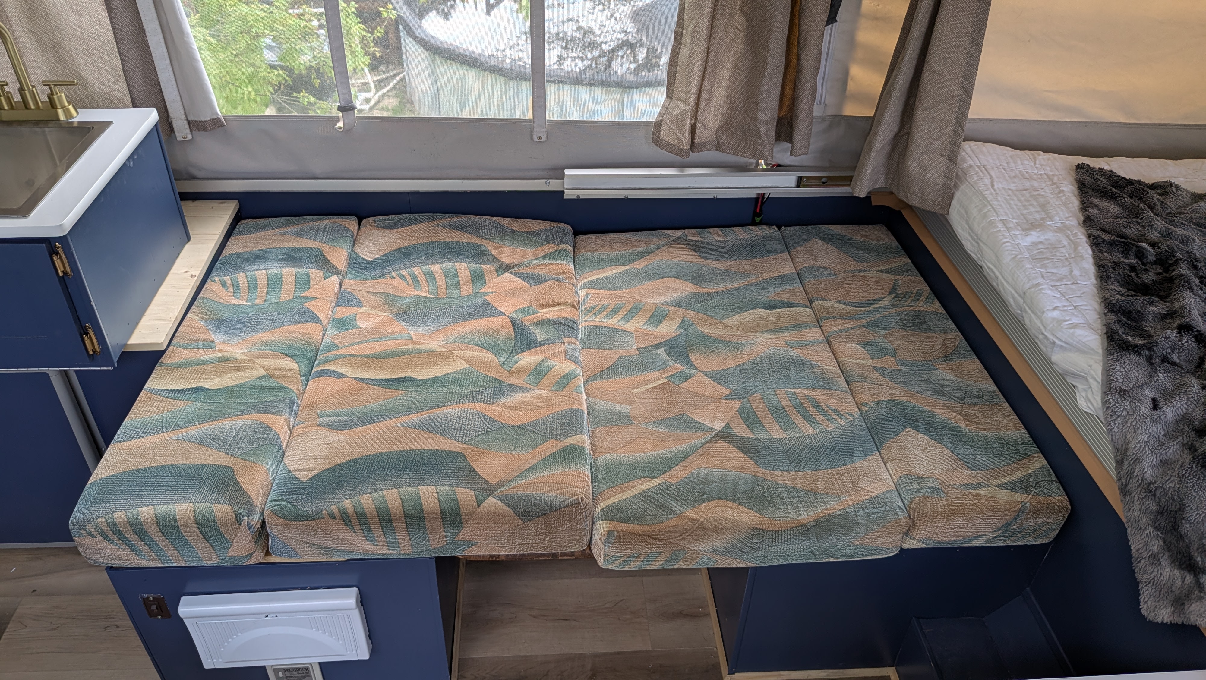 This RV rental's versatile interior showcases a small kitchen, comfy dinette, and rear bed setup.. Coachmen Clipper 2008