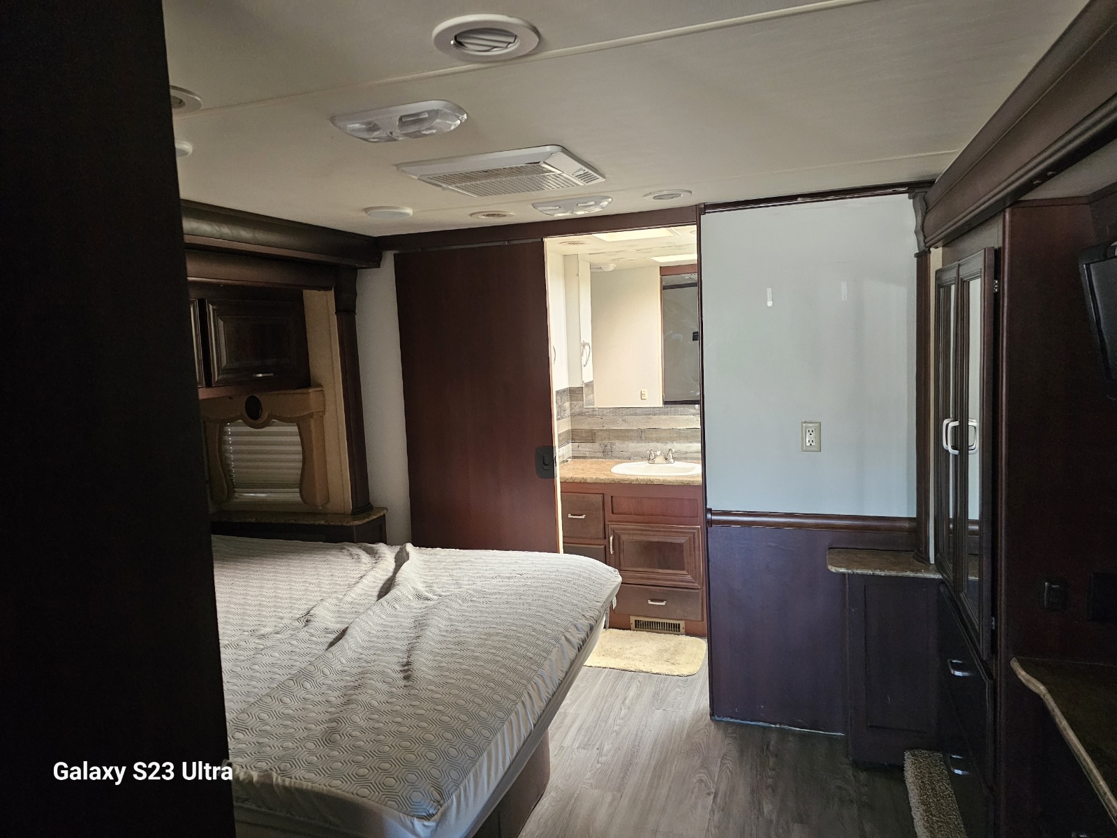 RV rental: Comfortable bedroom interior opening to a connected bathroom with sink and vanity.. Damon Corporation Challenger 2011