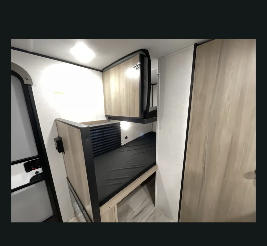 This rv rental features a compact sleeping area with an innovative foldable top bunk bed, maximizing interior space.. Coleman 13b 2025