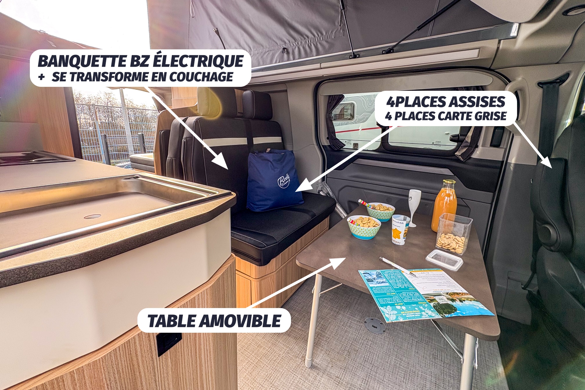 Inside an rv rental camper van: electric sofa bed, removable table, and seating for 4. Functional, compact living space.. Stylevan Nouveau Bélize 2025