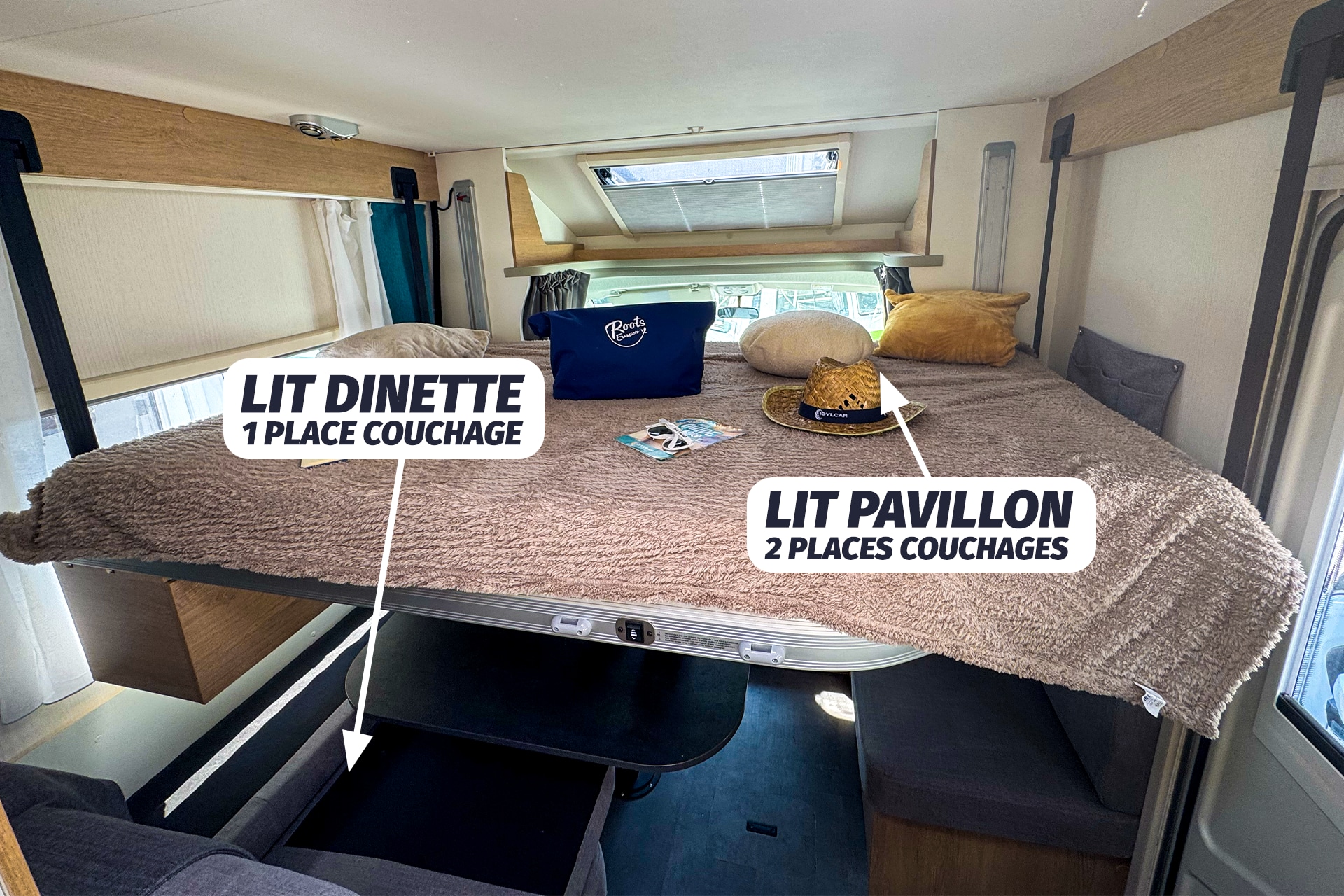 RV rental interior showing two beds: an elevated bed for 2 & a dinette bed below for 1. Perfect sleeping arrangements.. JOA CAMP JOA 75T 2024