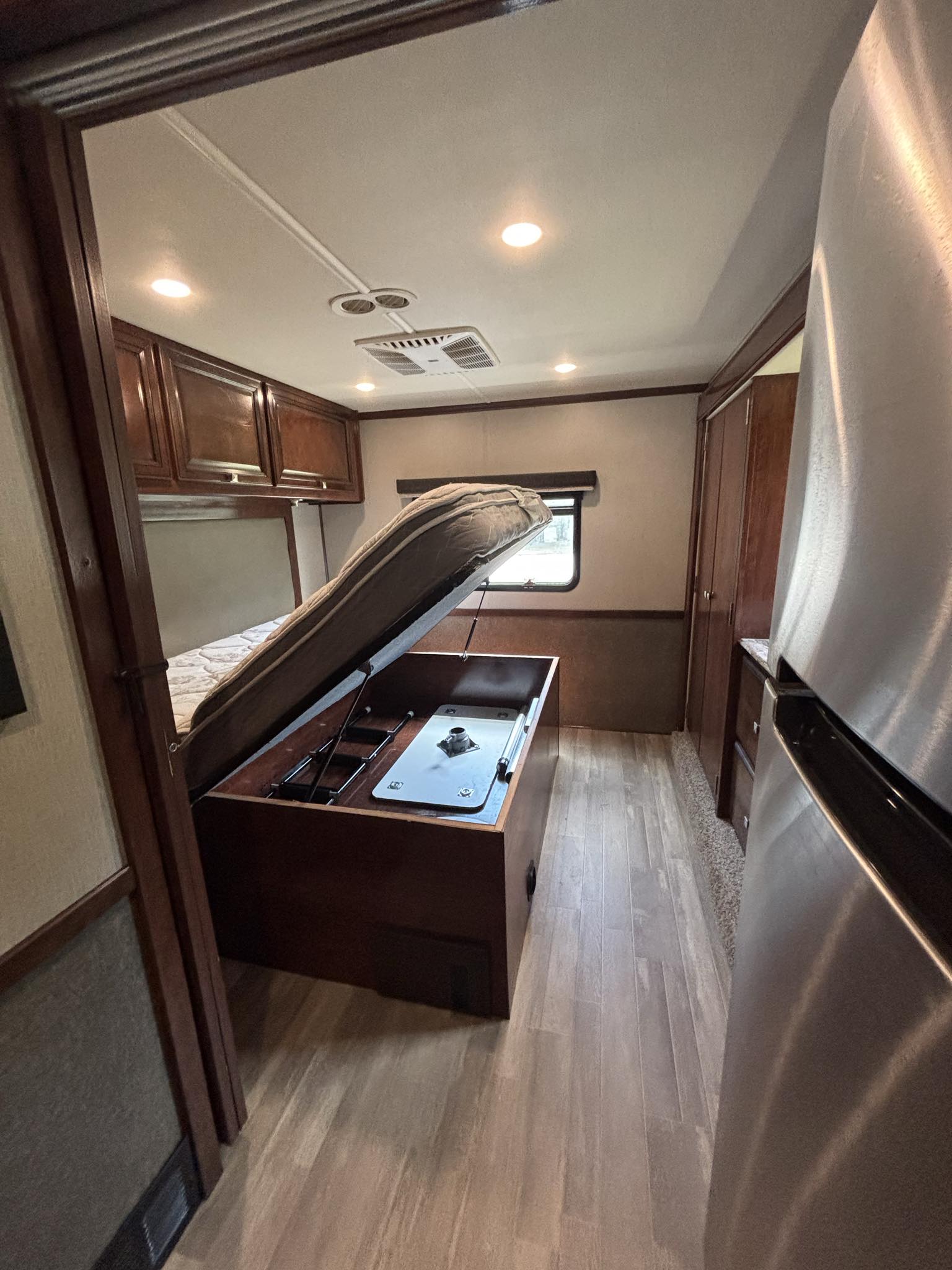 RV rental: Camper interior with a bed that lifts, revealing under-bed storage & a table mount, maximizing travel space.. Holiday Rambler Admiral 2019