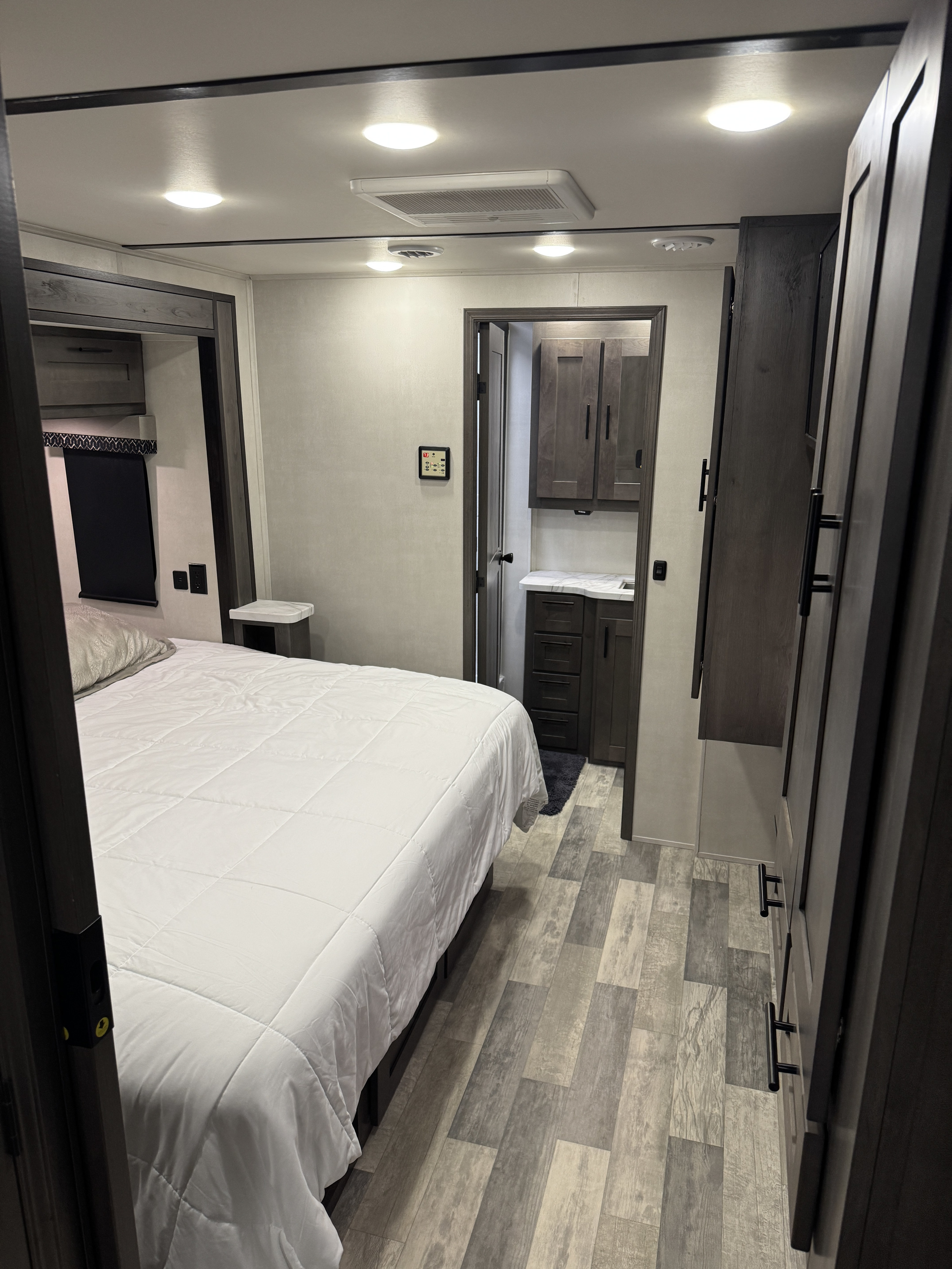 Spacious RV rental interior: modern bedroom with a comfortable bed and an accessible en-suite bathroom.. FR3 FR3 Motorhome 2022