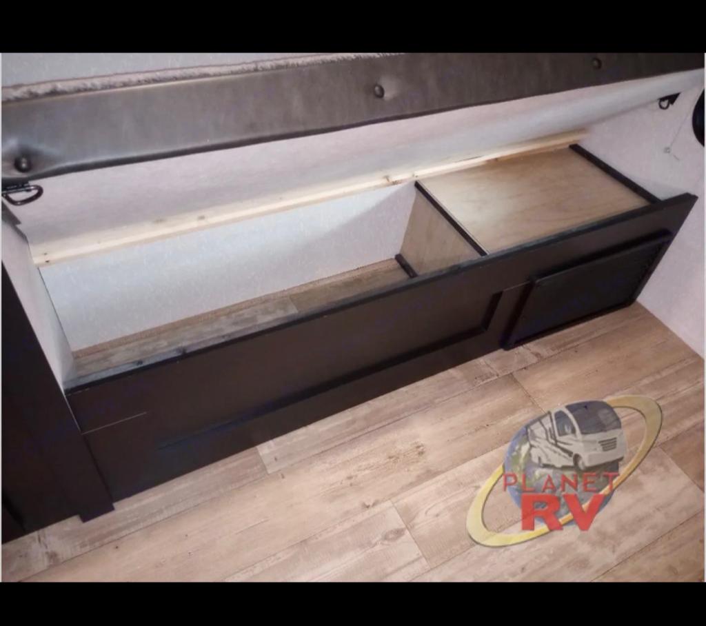 RV rental interior: See the under-bunk storage, featuring an open section & a closed drawer for your travel essentials.. Forest River Cherokee 2022