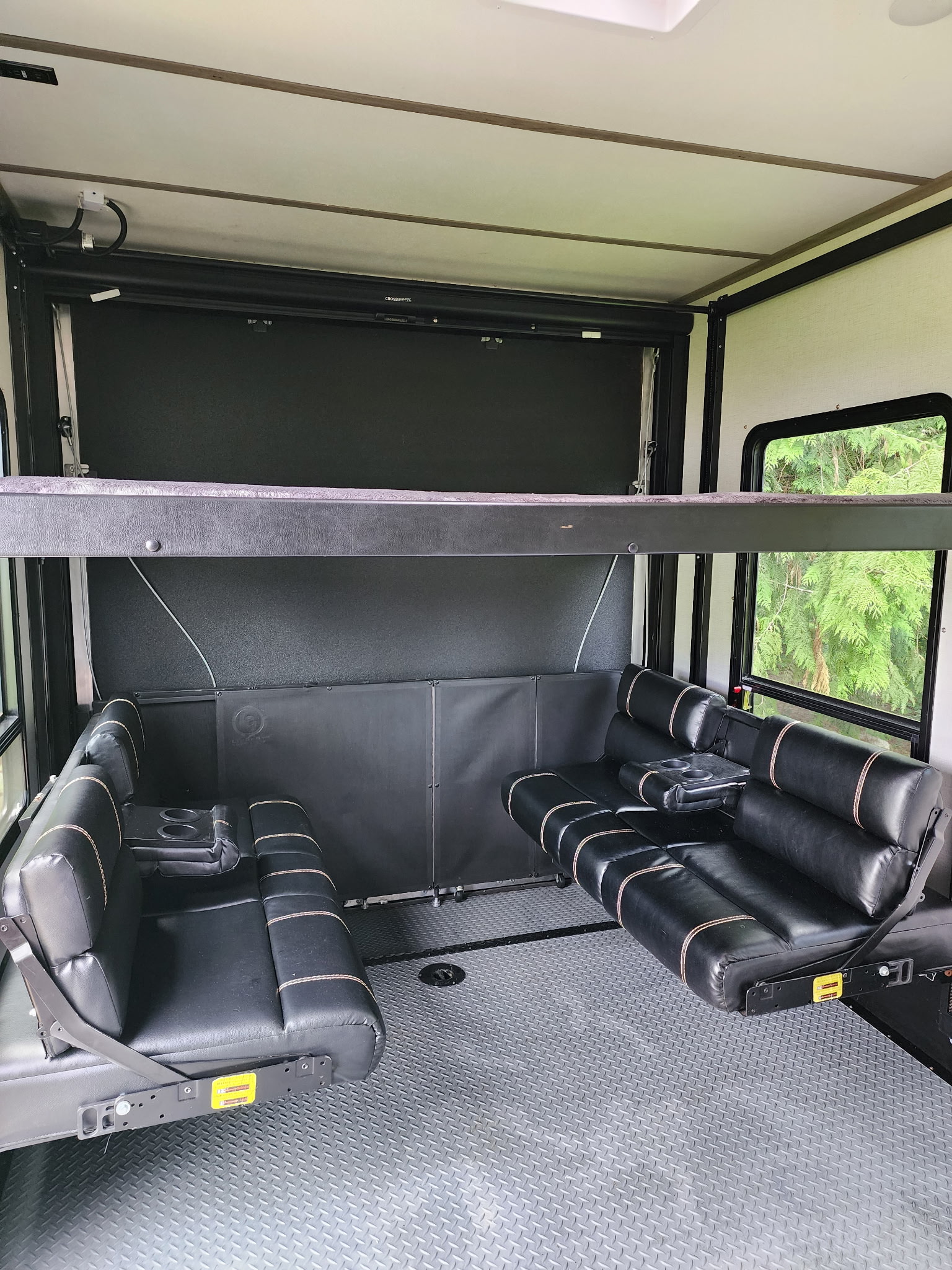 RV rental's versatile interior: fold-down bunk, convertible sofas, and durable floor.. Keystone Carbon 2021