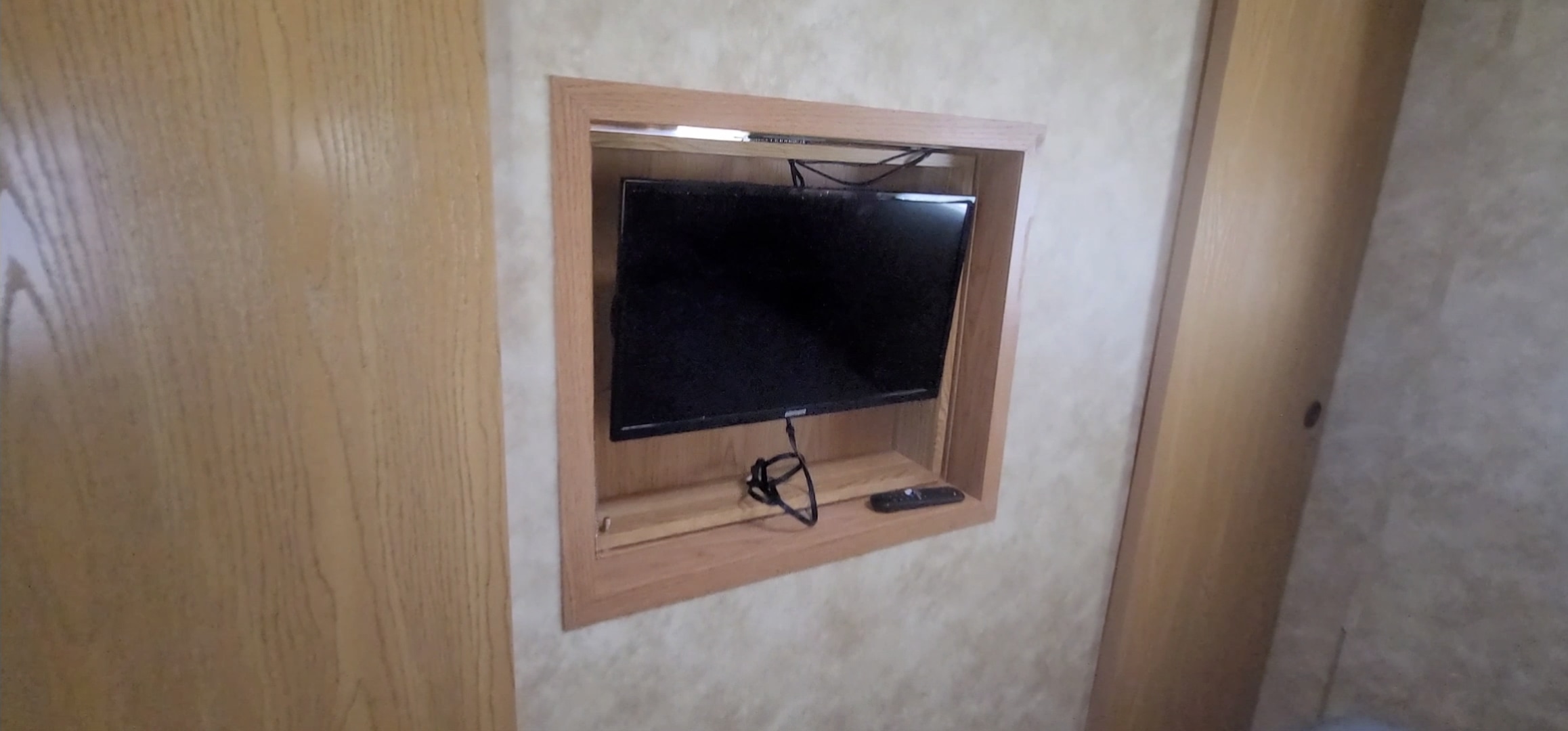 Entertainment ready! This RV rental features a built-in flat-screen TV and wooden interior, complete with remote.. Heartland RVs North Country 2009