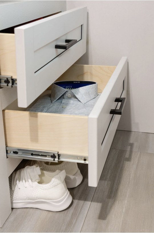 RV rental: White pull-out drawers, one with a shirt, white sneakers below. Practical storage for compact living.. Go Play 26BH 2025