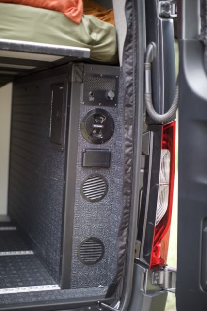 RV rental detail: Integrated utility panel with power, water fill, and ventilation for a comfortable campervan adventure.. Storyteller Overland Storyteller Overland Class B 2023