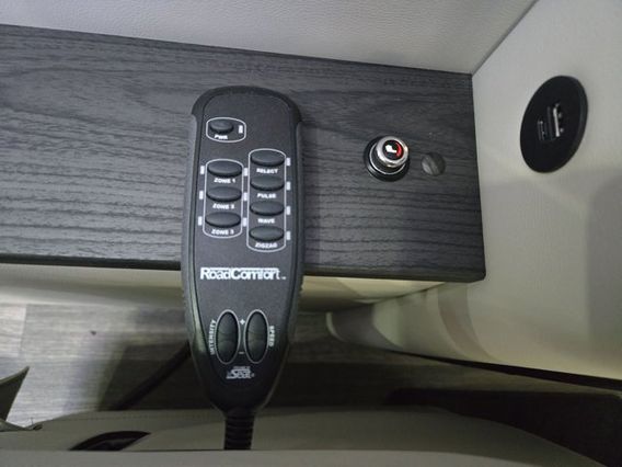 RV rental comfort: RoadComfort massage remote with adjustable zones, pulse, wave, zigzag modes, plus a handy USB charging port.. Ultimate Toys Ultimate RV 2026