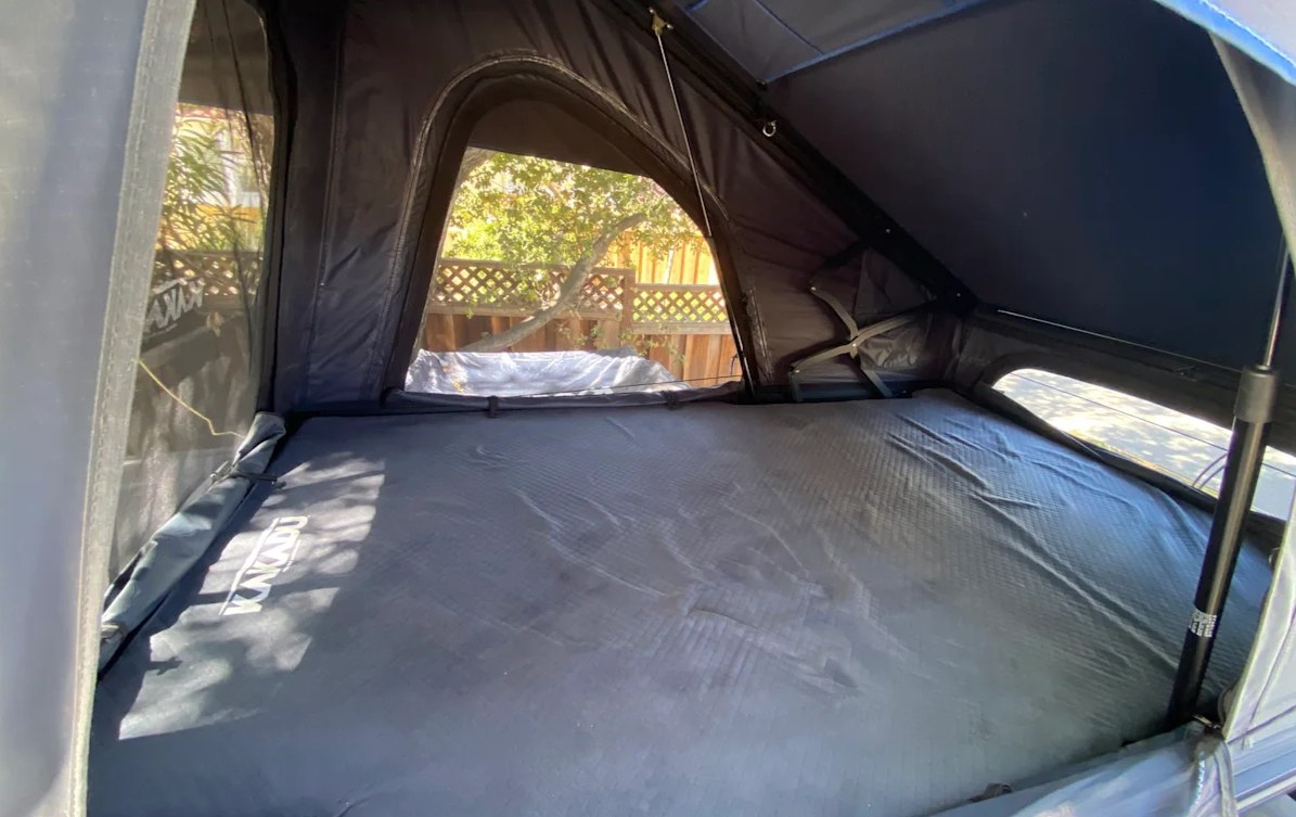 Inside a spacious KAKADU rooftop tent with mattress, offering views for your next rv rental camping trip.. ITWO custom Pixtech Bearlander 20 2024