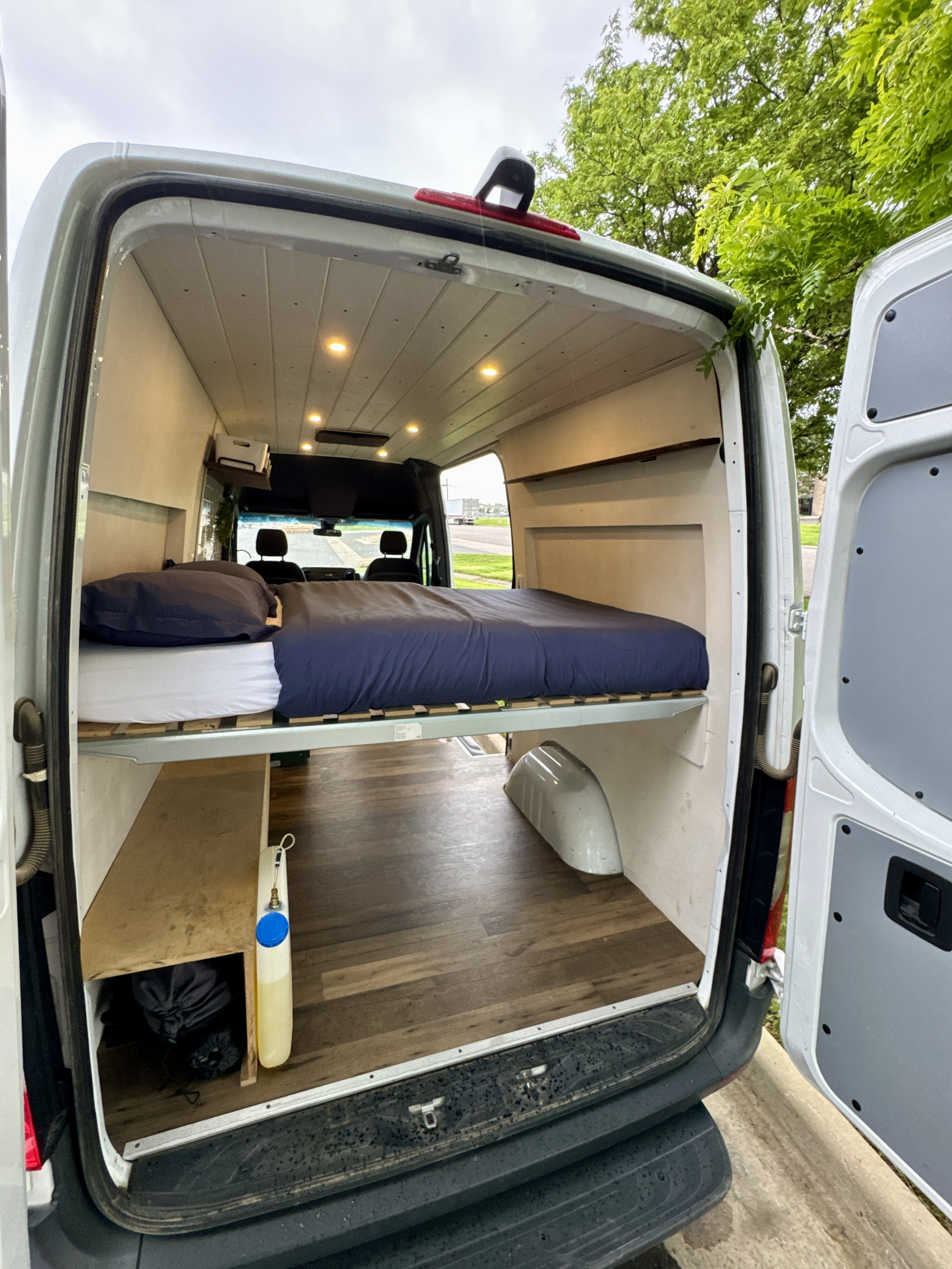 Experience van life! This rv rental camper van conversion offers a cozy bed & ample storage from its open back.. Mercedes-Benz Sprinter 2020