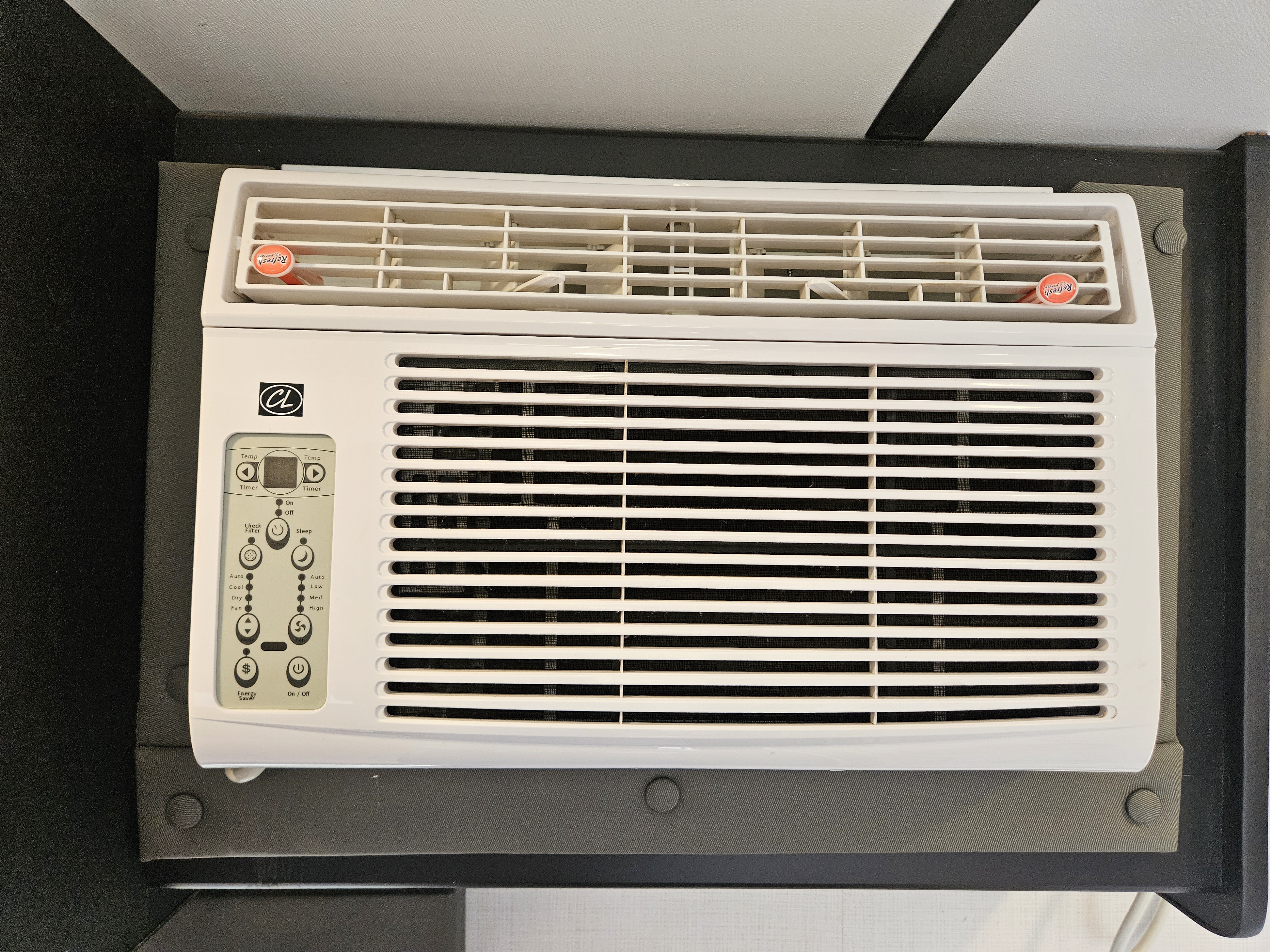 RV rental wall-mounted AC unit with control panel and "Refresh" air freshener for climate control.. Keystone RV Springdale 2023